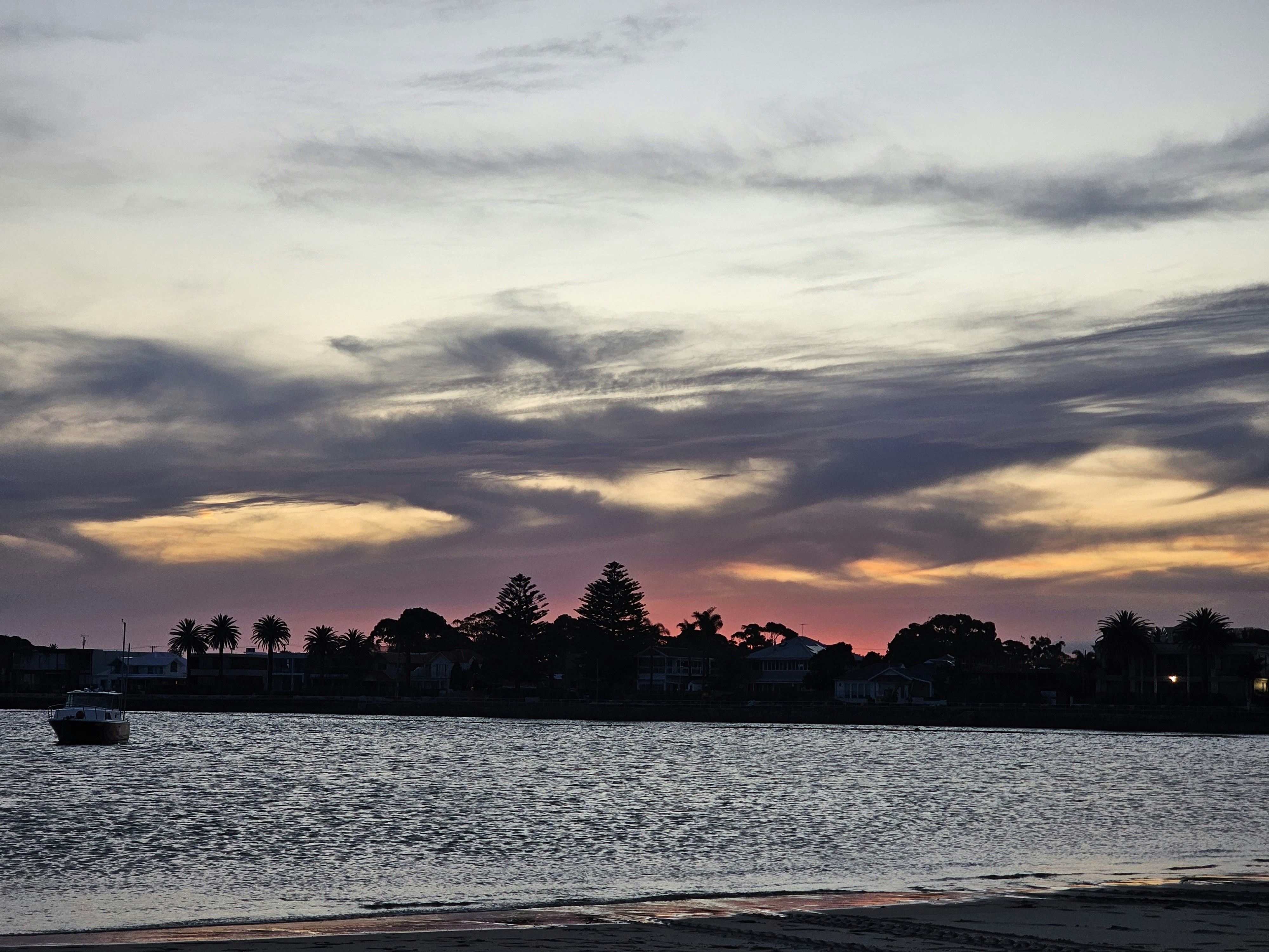 A body of water with a boat in the distance