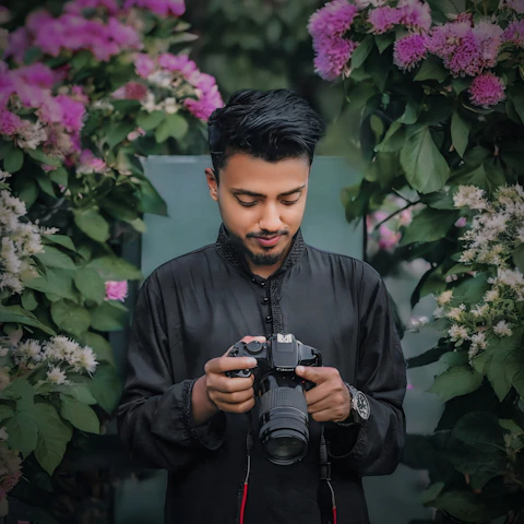 A man taking a picture of himself with a camera