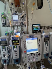 A hospital room with medical equipment and monitors