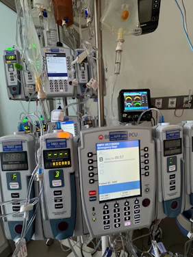 A hospital room with medical equipment and monitors