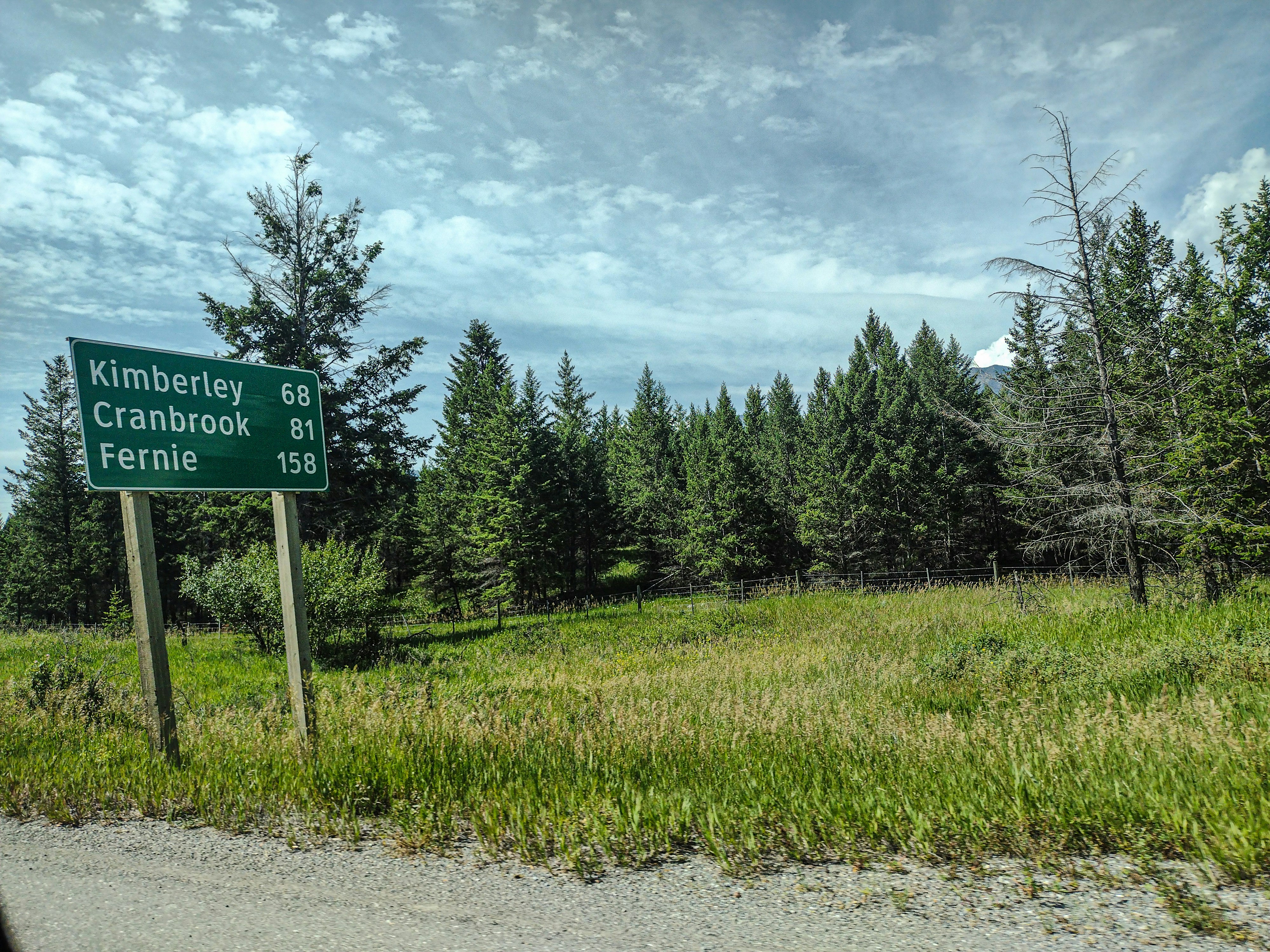 A road sign on the side of a road