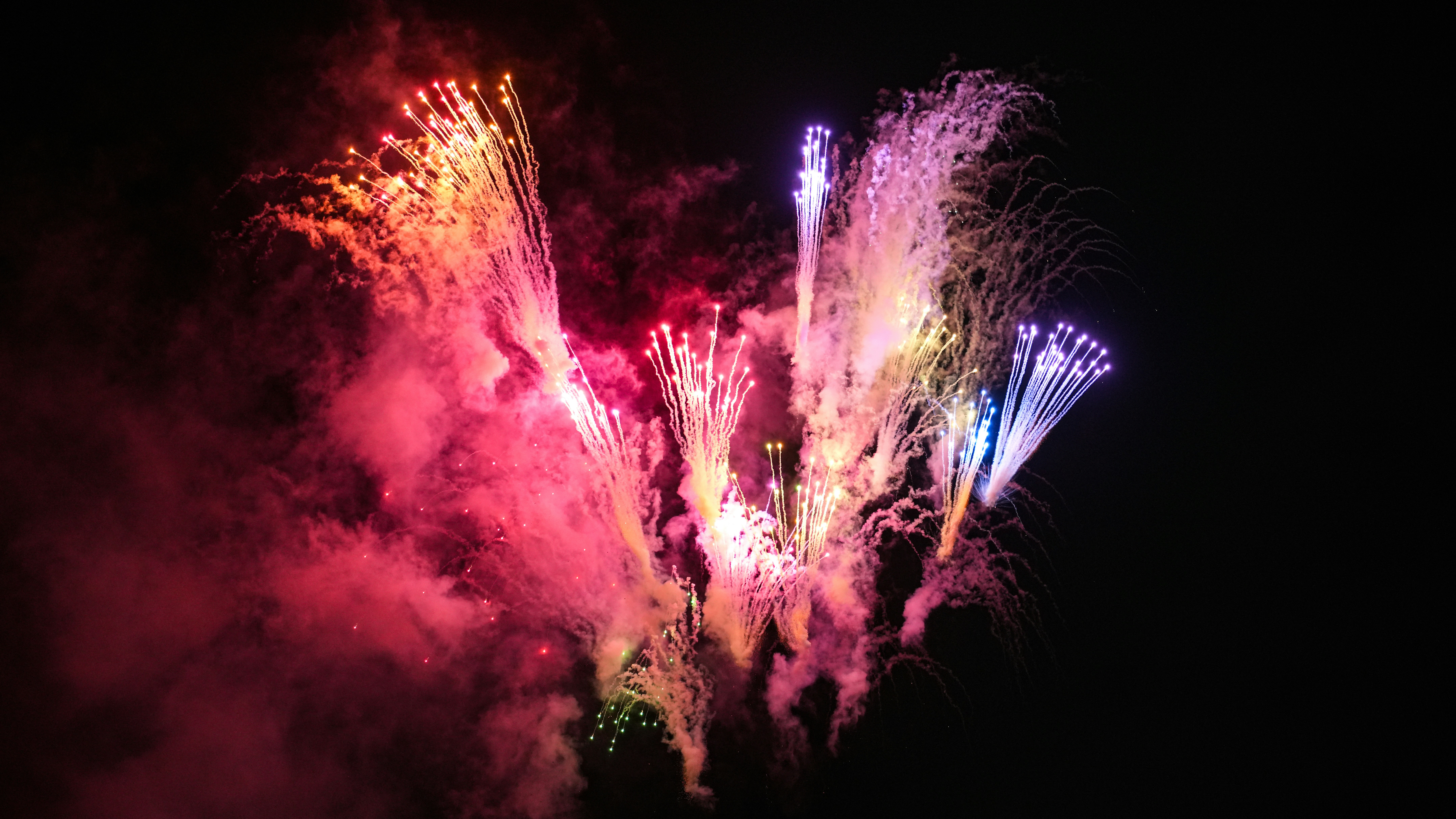 A bunch of fireworks are lit up in the night sky photo – Free Night ...