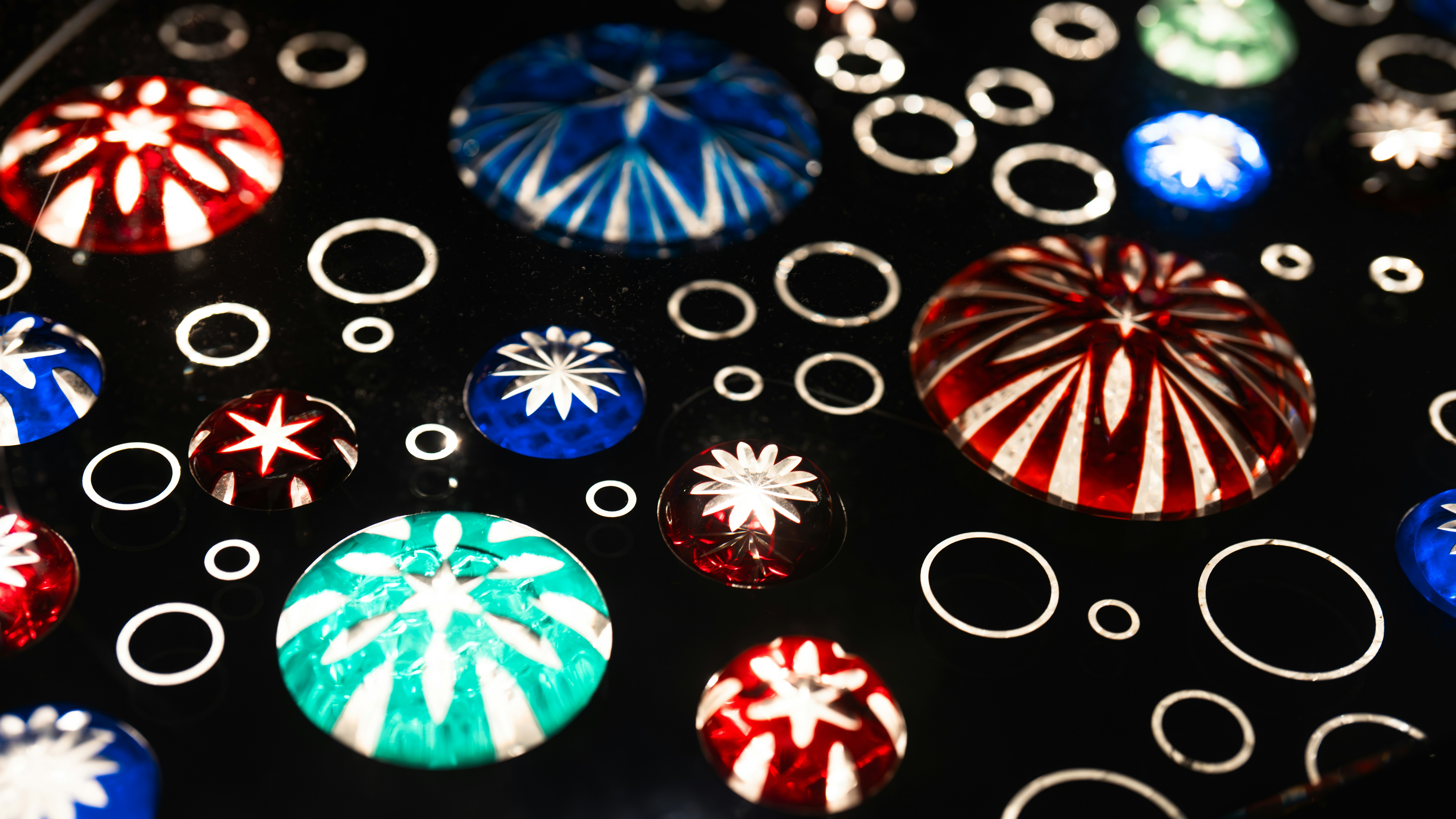 A close up of a bunch of different colored buttons