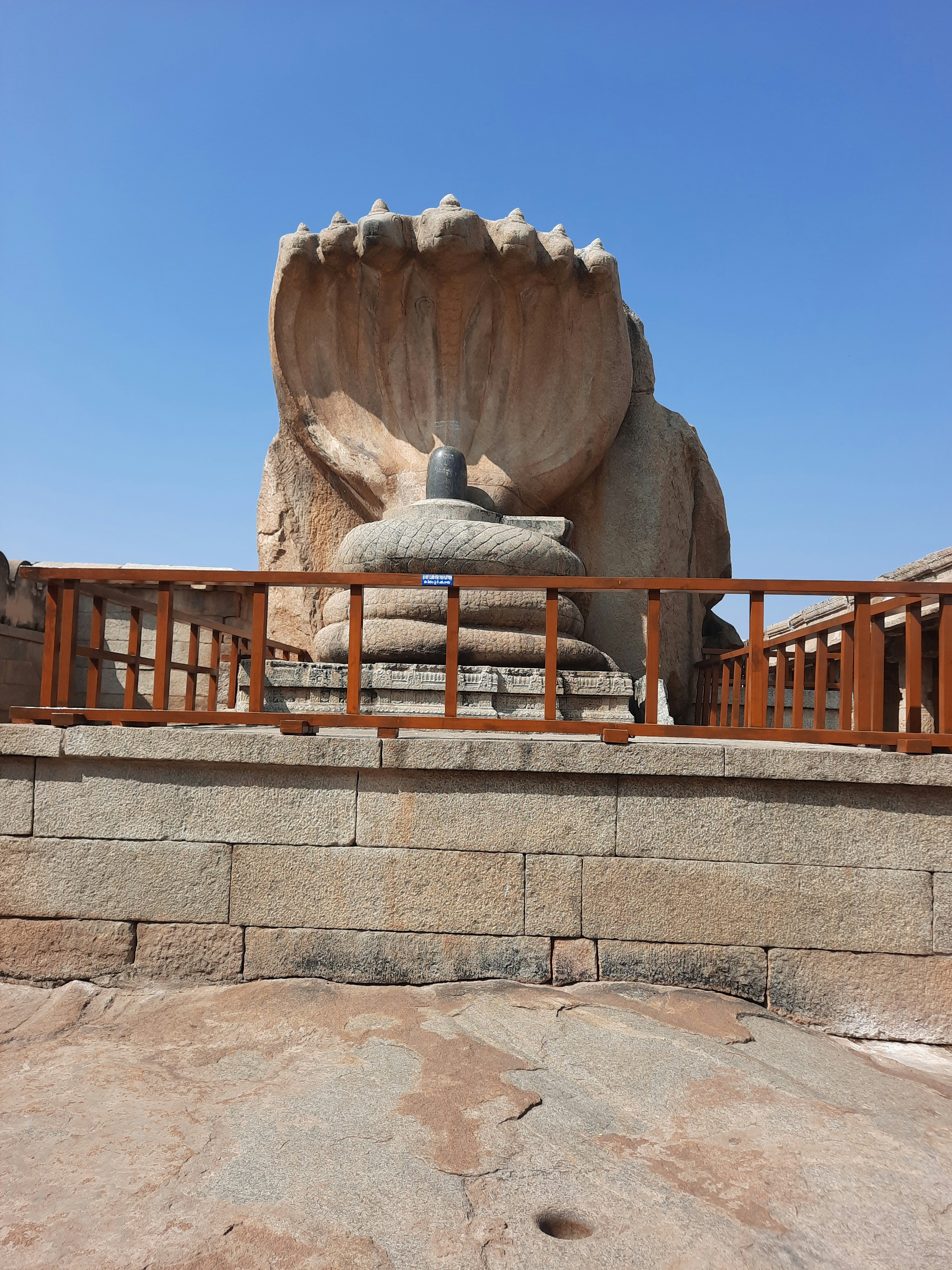 A statue of a shell on top of a hill