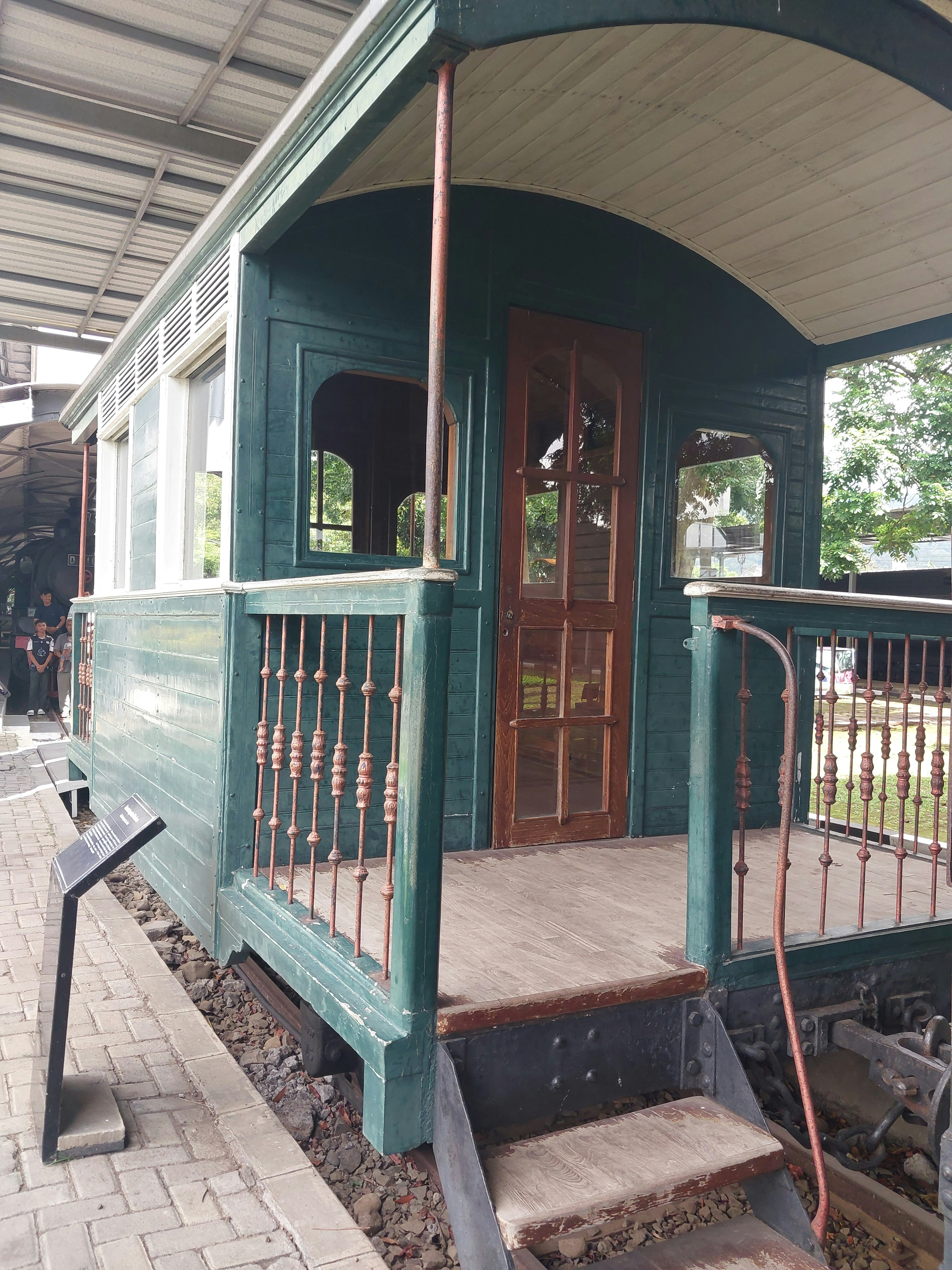 A train station with a train on the tracks