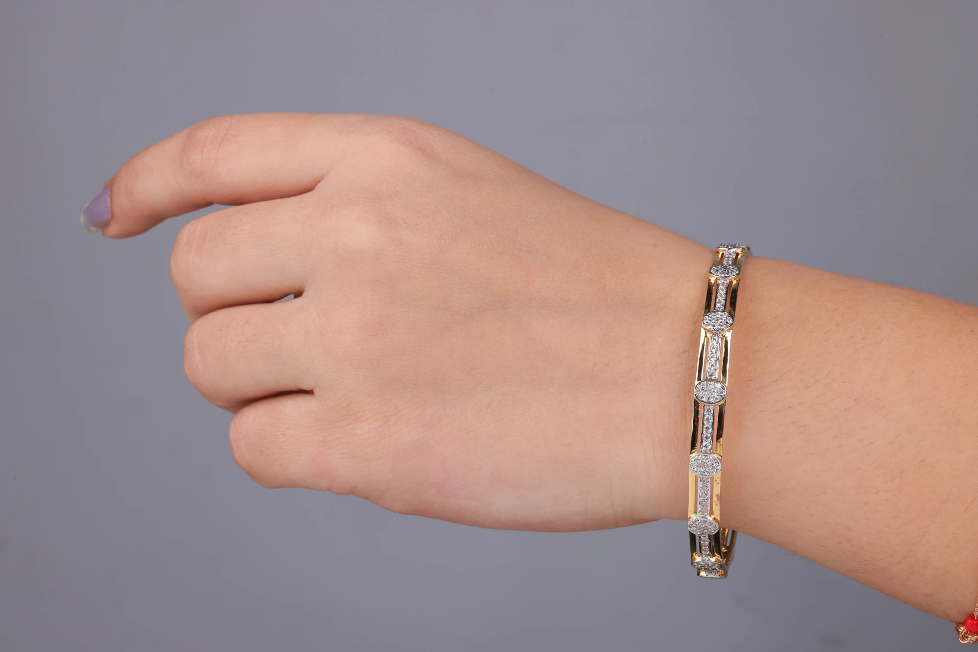 A woman's arm with a bracelet on it