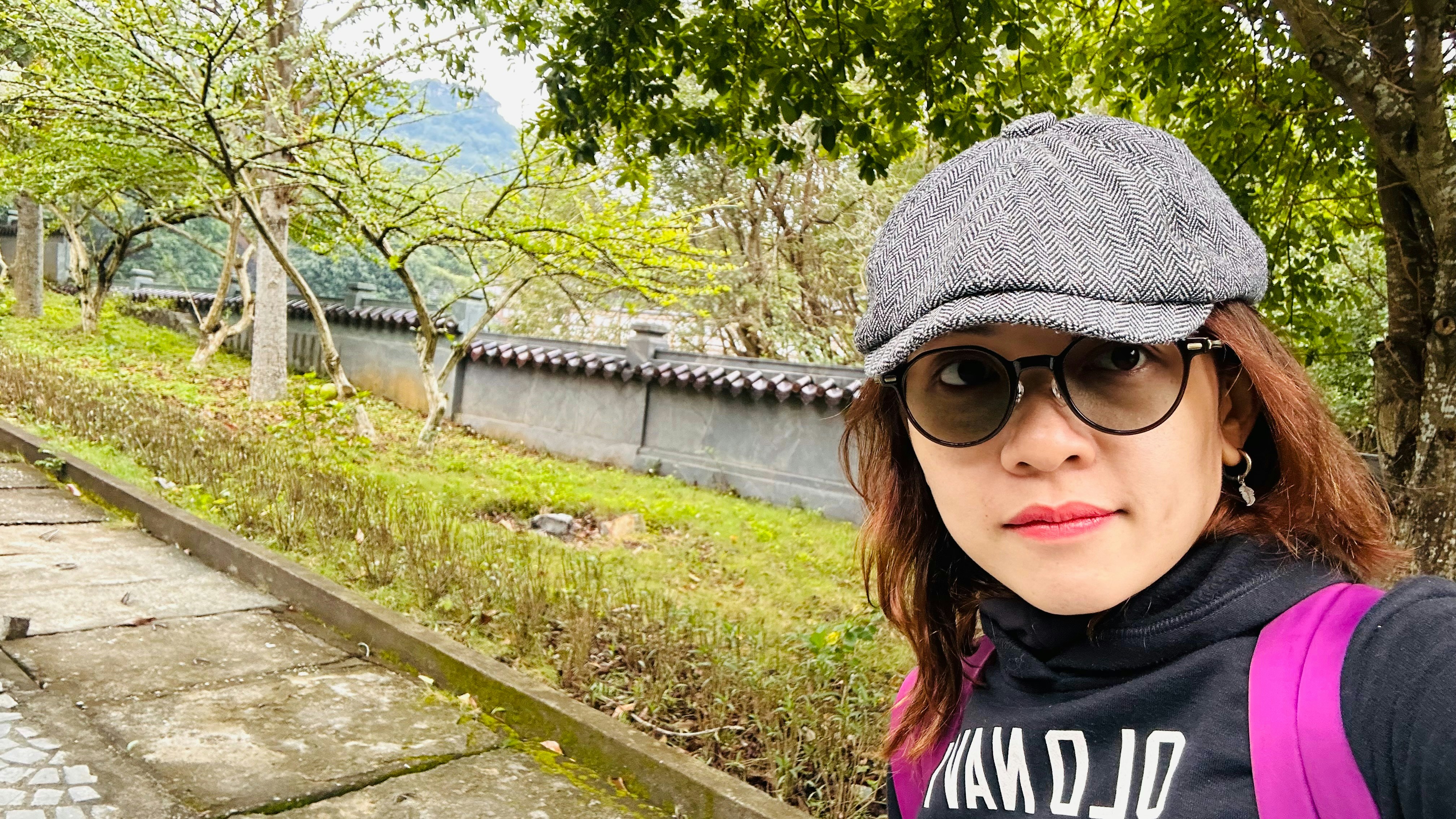 A woman taking a selfie with a camera