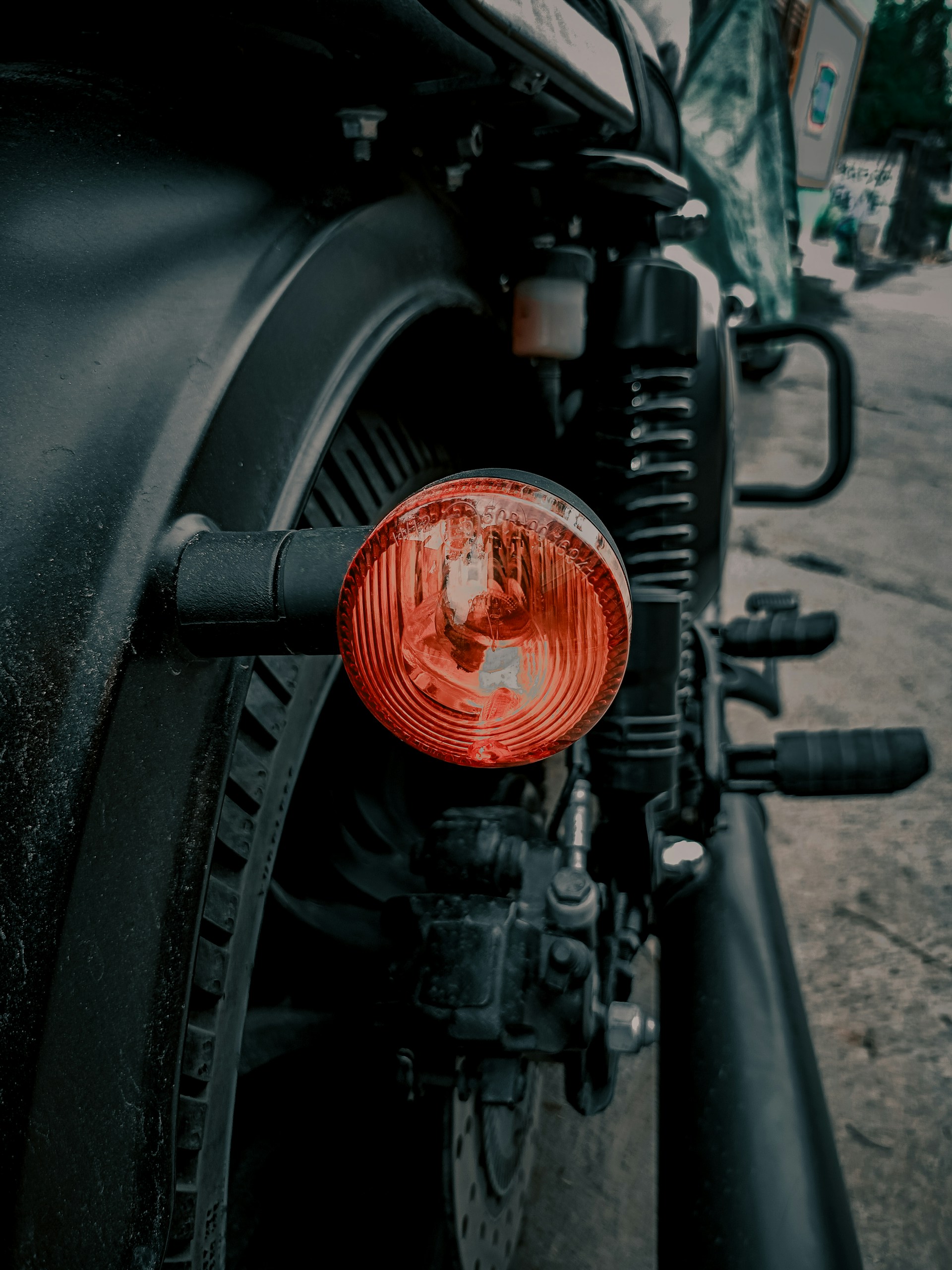 A motorcycle parked on the side of the road