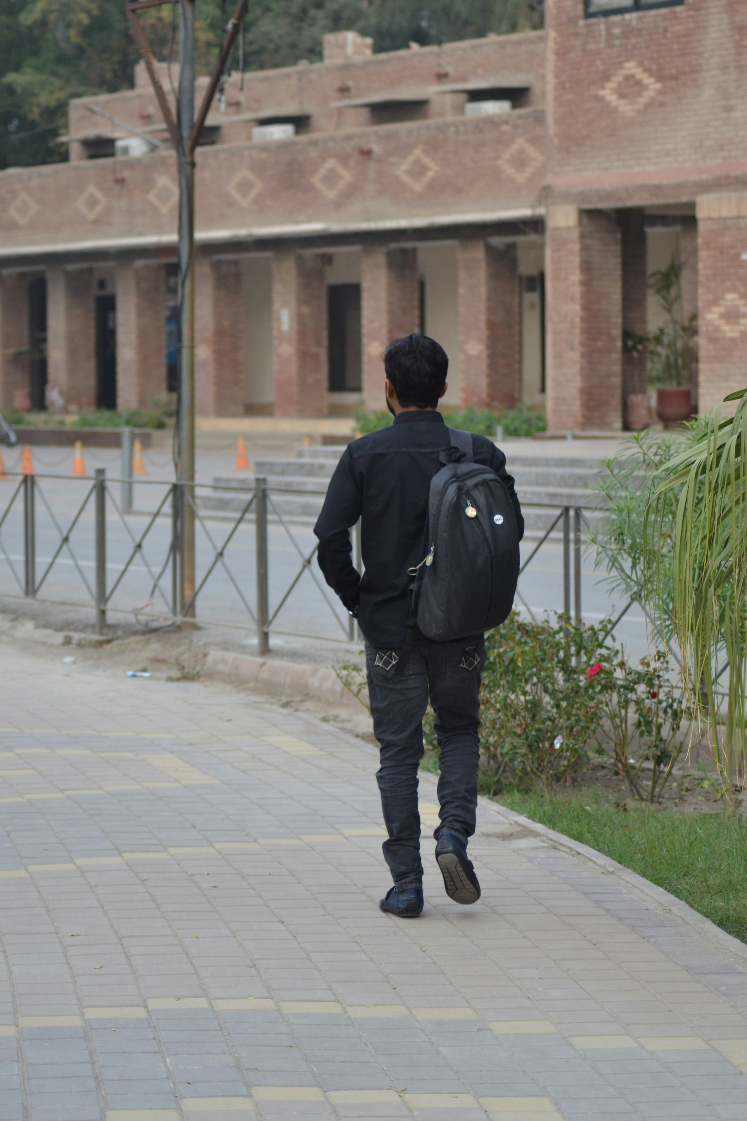 woman wearing yellow long-sleeved dress under white clouds and blue sky during daytime