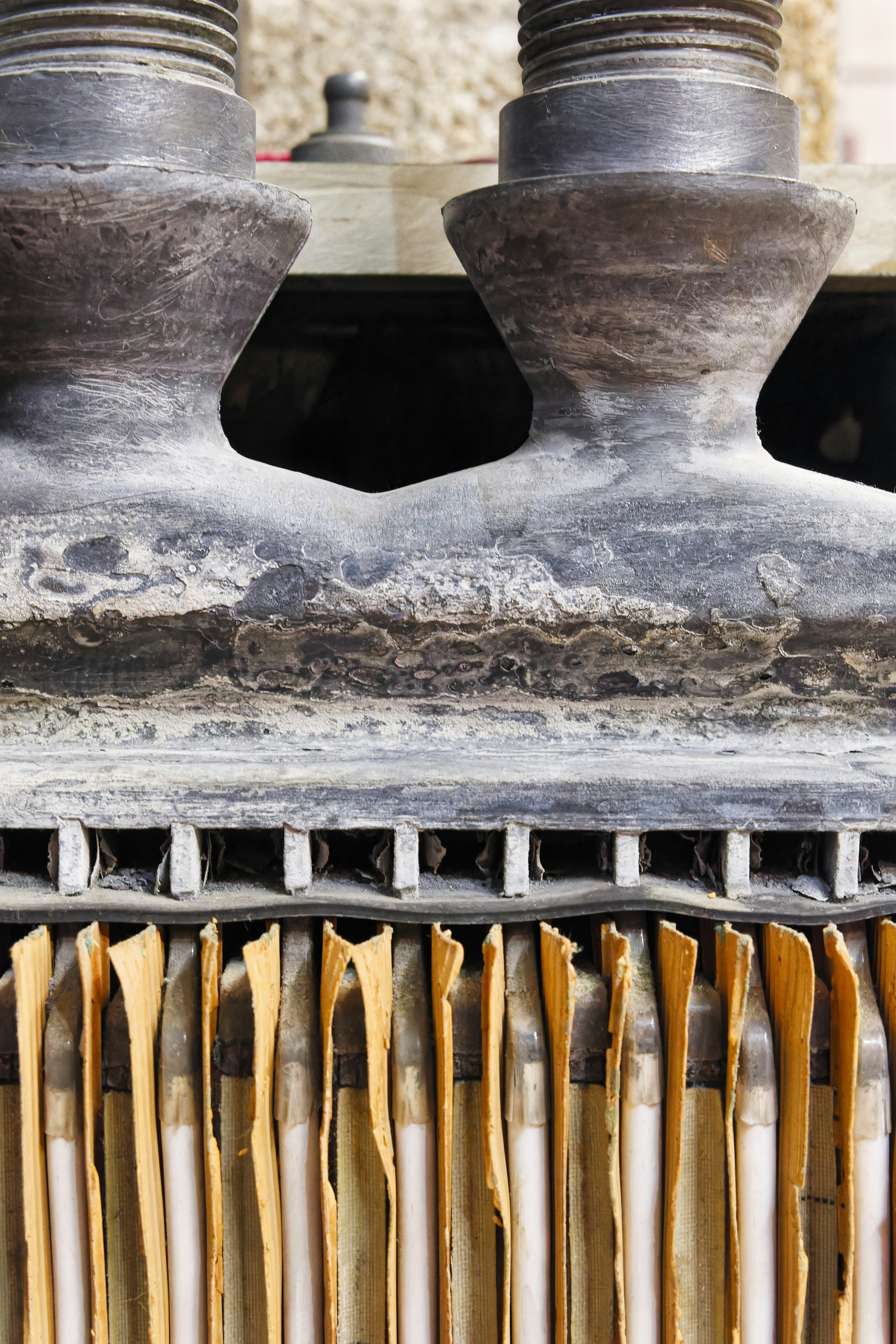 A close up of a machine with a bunch of wooden utensils