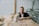 A man sitting at a table with a laptop