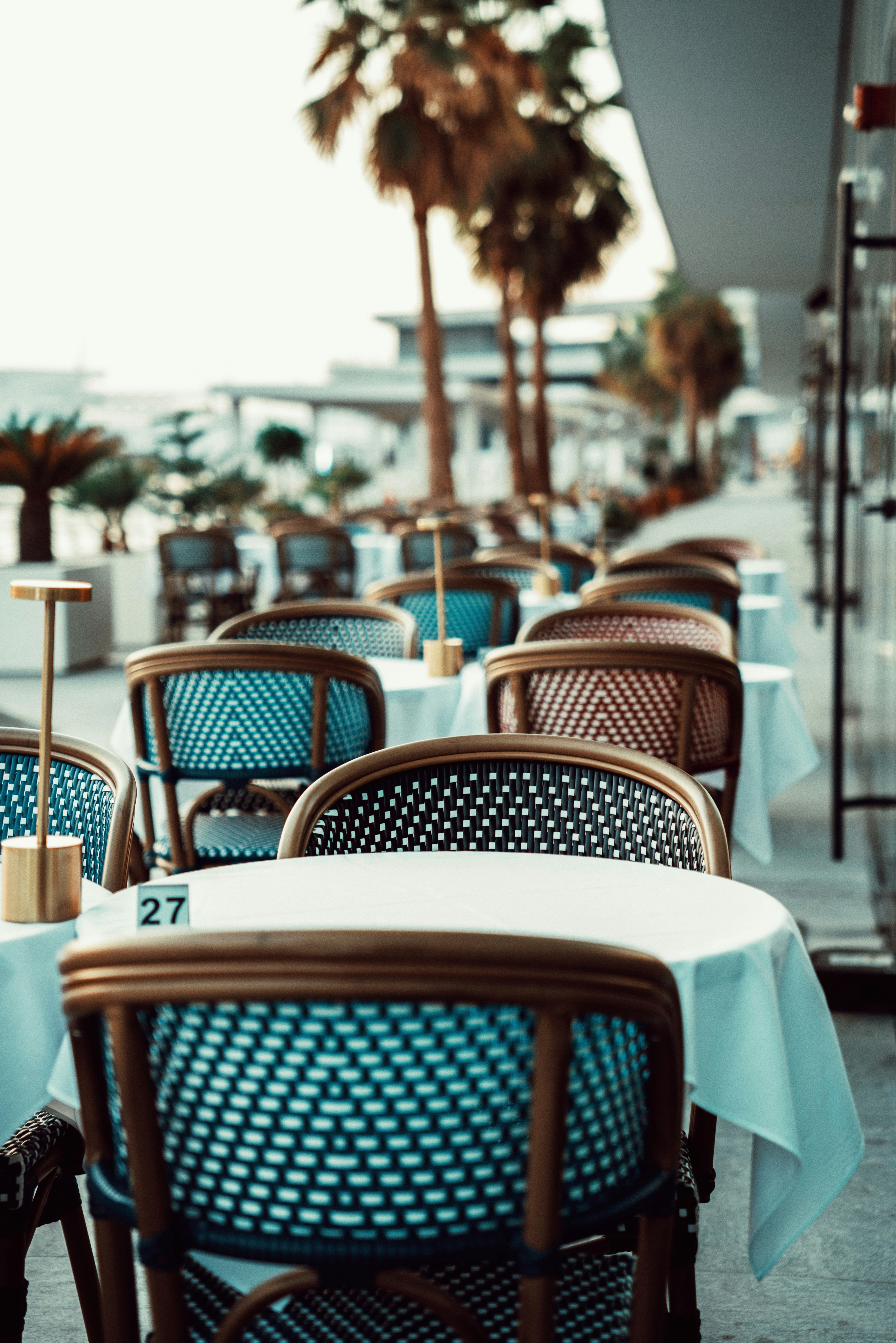 A row of blue and brown chairs sitting next to each other