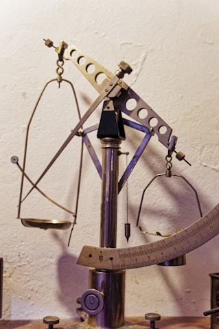 A large metal object sitting on top of a wooden table