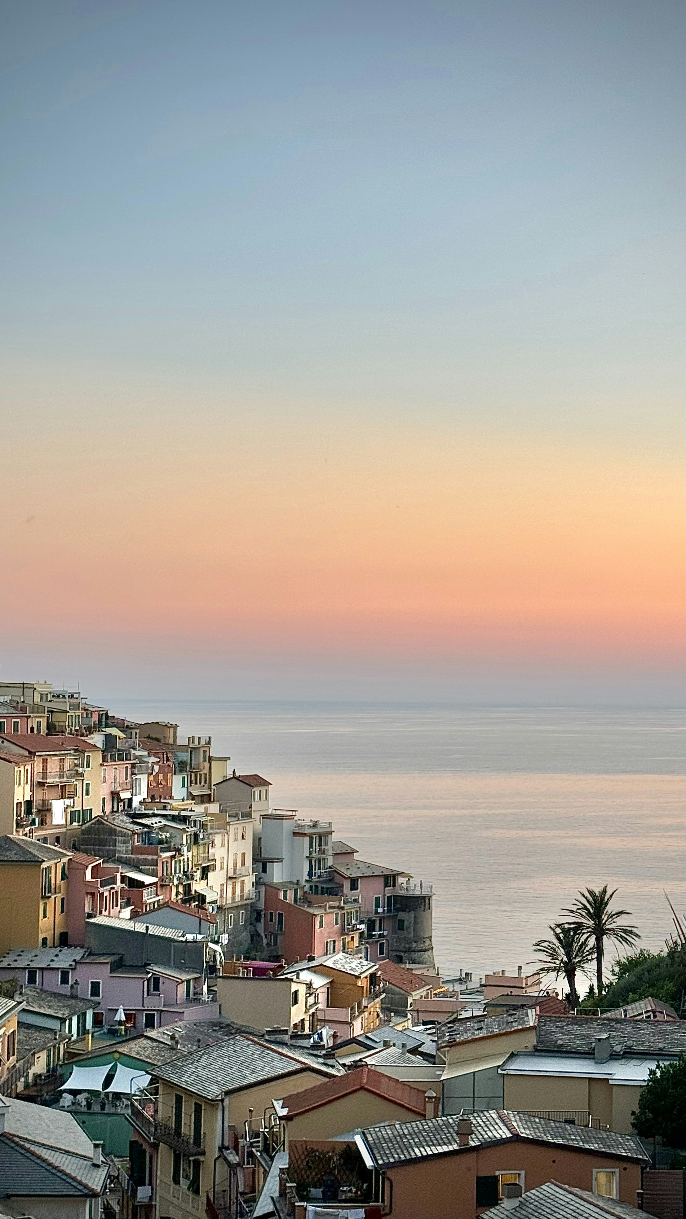 A view of a city with a body of water in the background