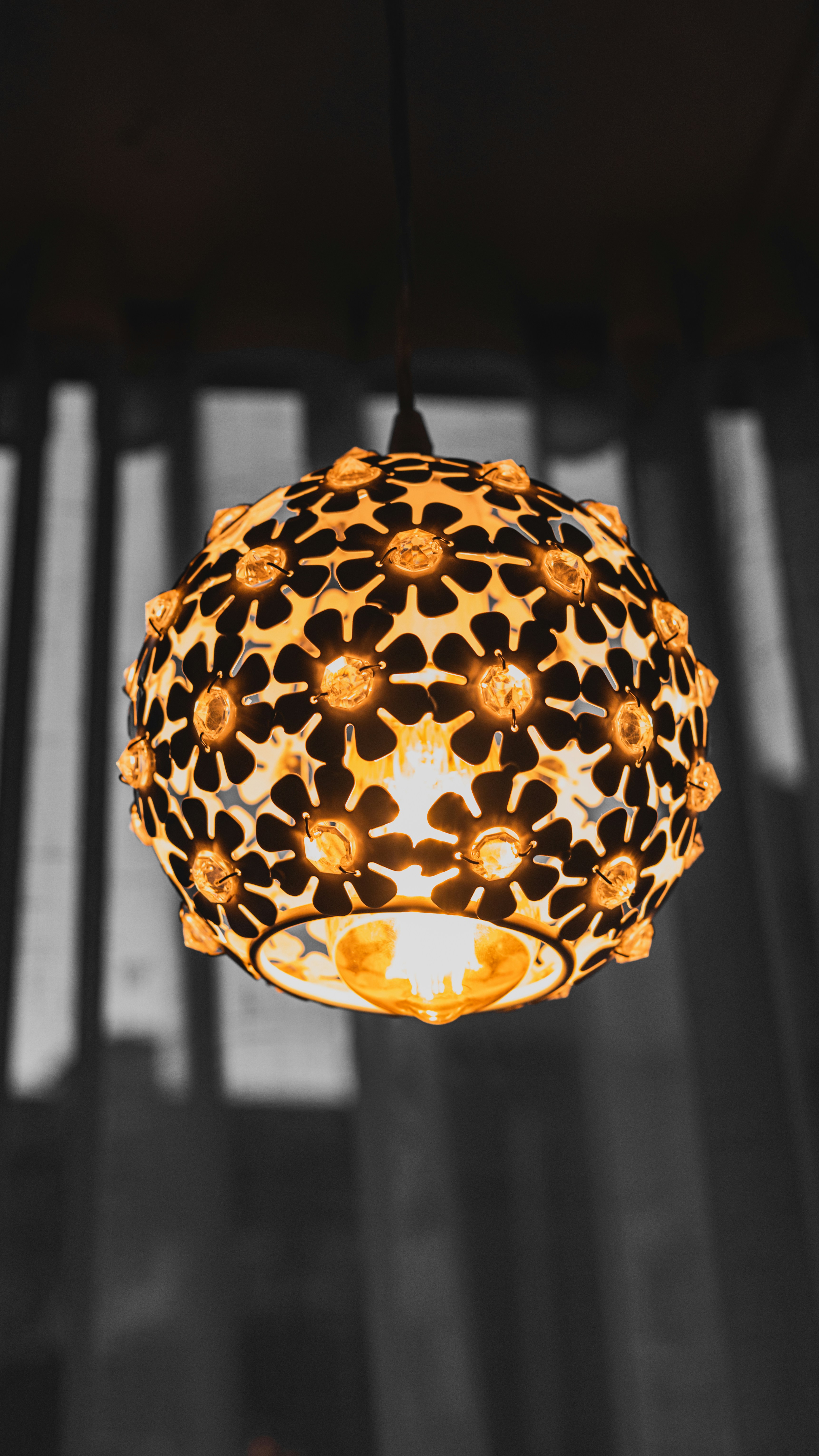 A lamp hanging from a ceiling in a room