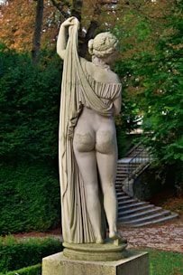 A statue of a woman holding a tree