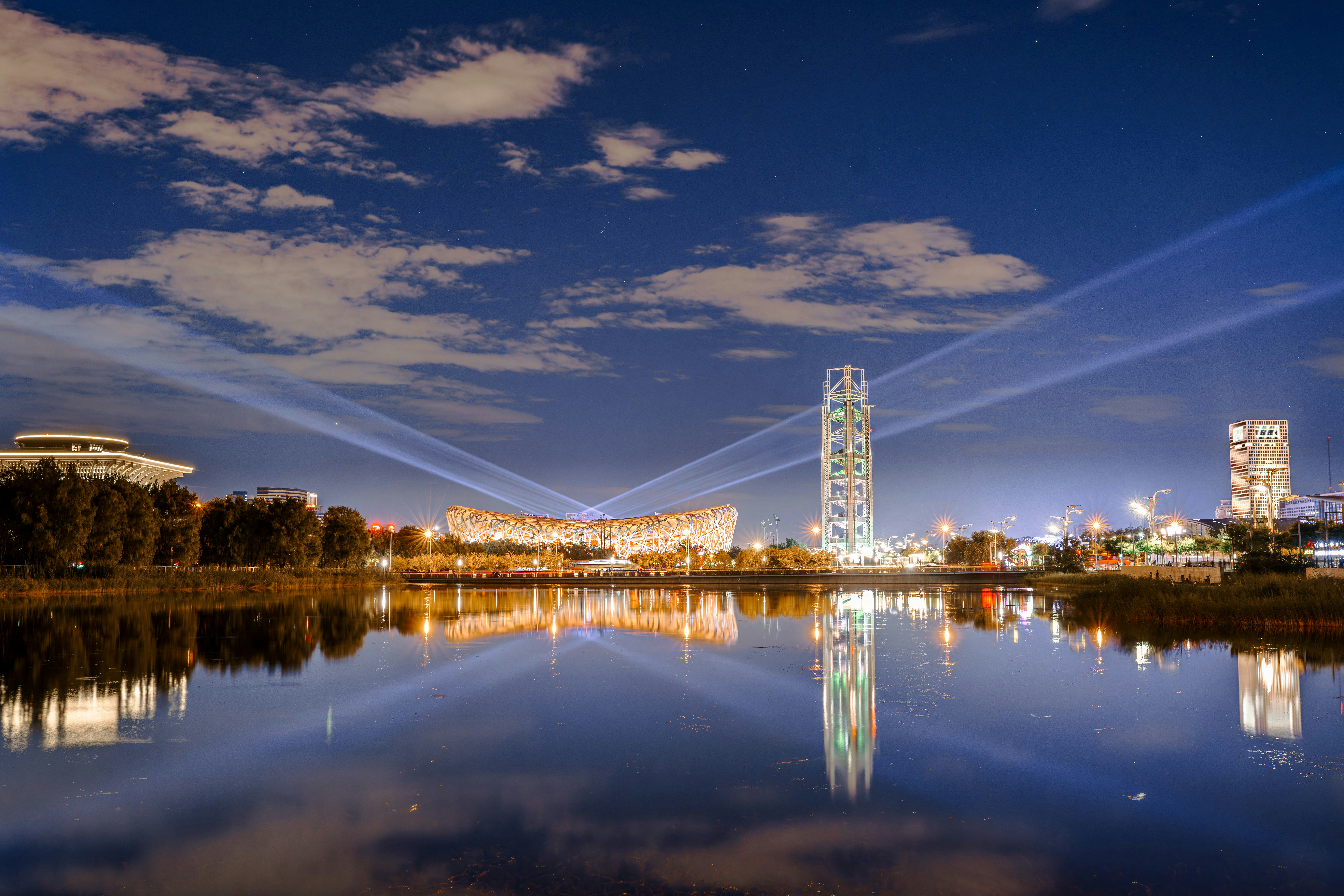 A view of a city across a lake at night