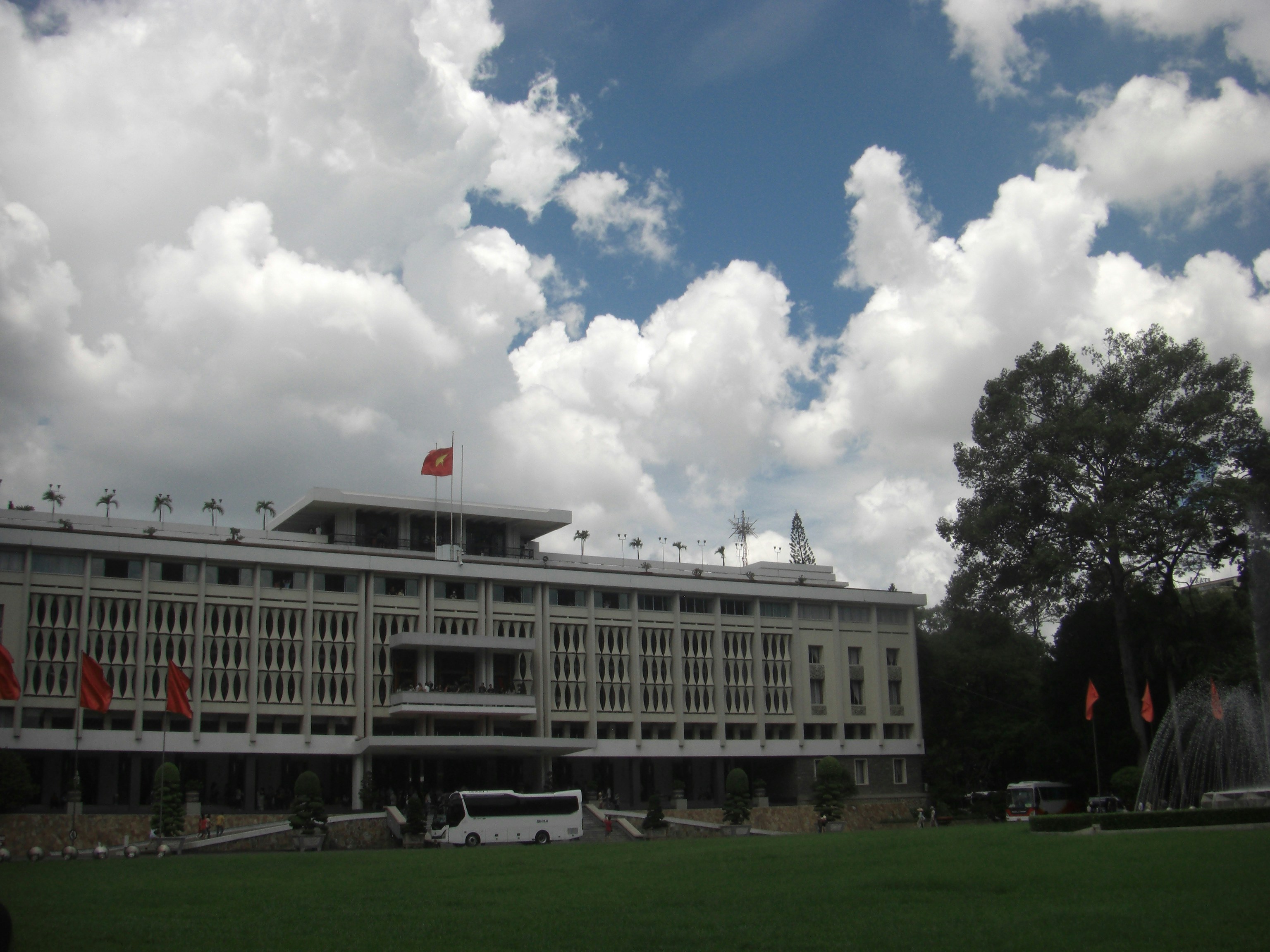 A large building sitting on top of a lush green field