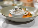 A white plate topped with rice and meat