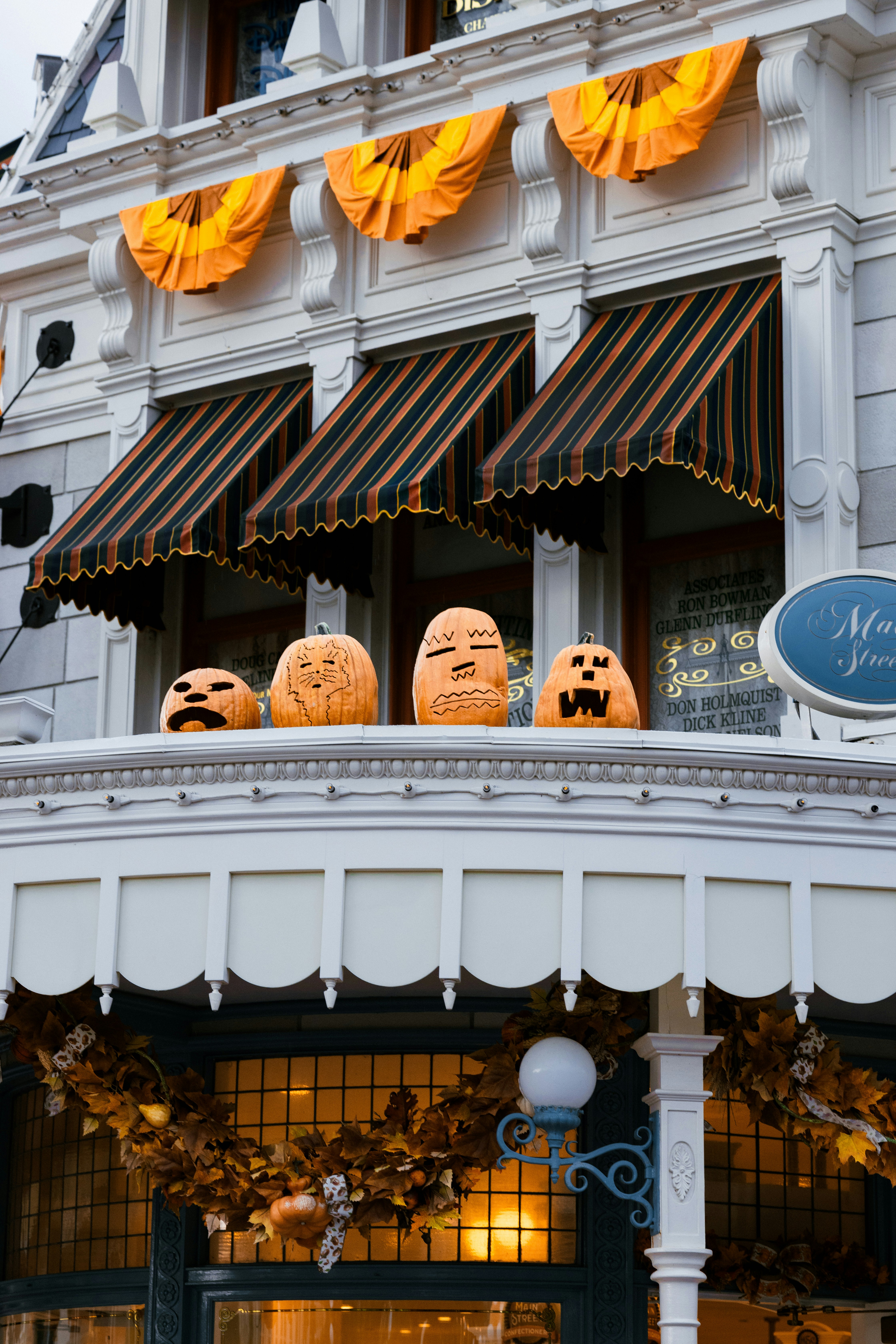 A store front with carved pumpkins on display