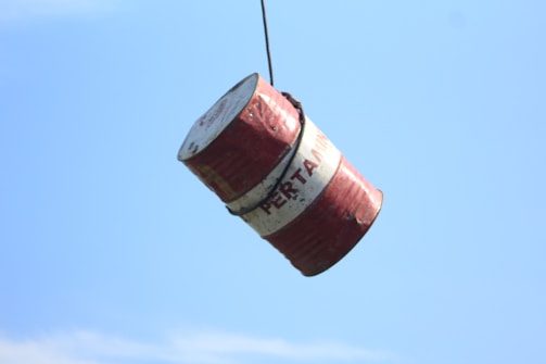 A bucket being lifted by a crane