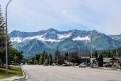 A street with a mountain range in the background