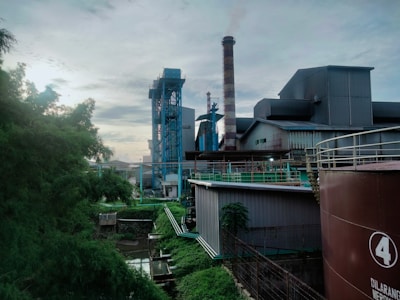 A factory with smoke stacks in the background