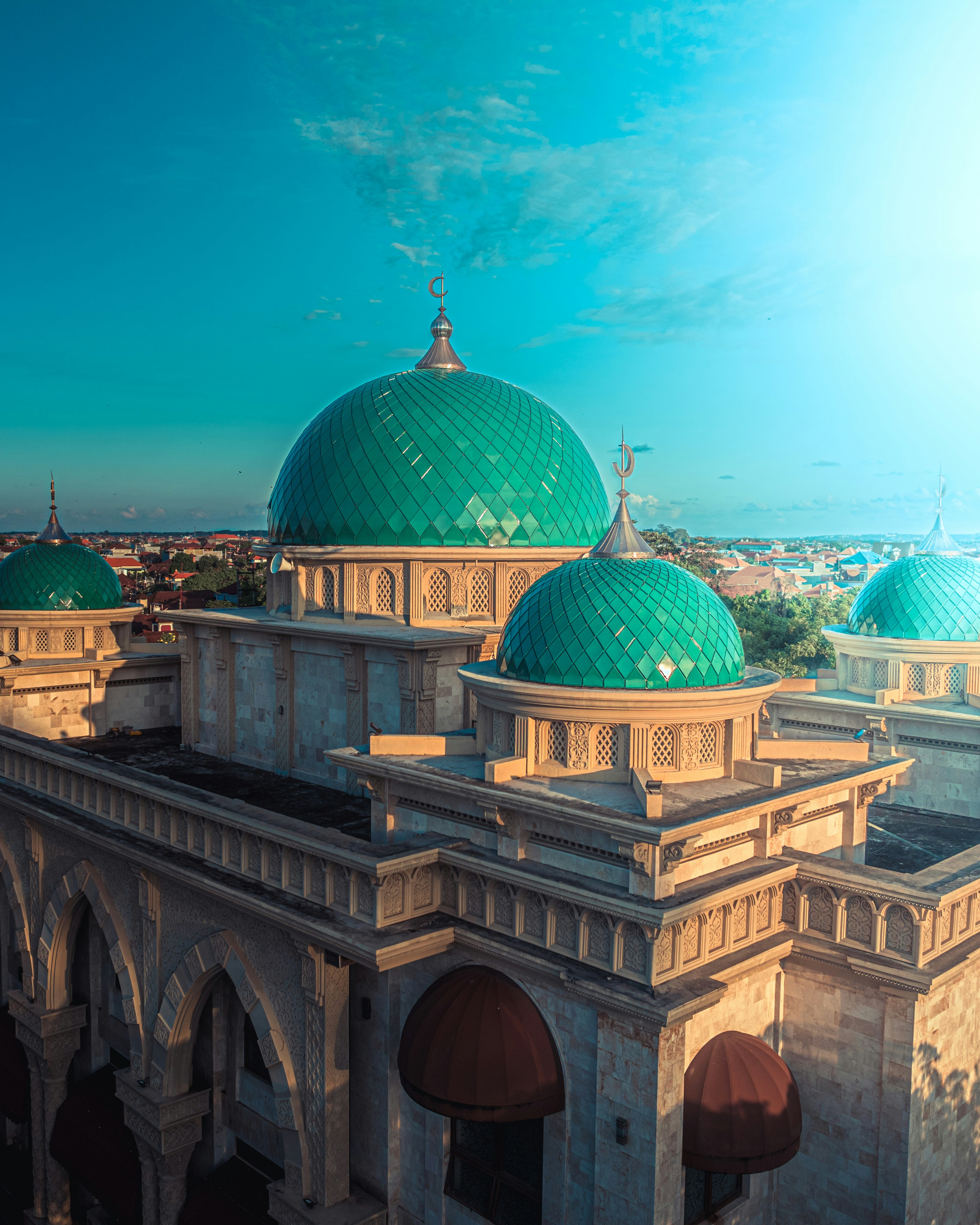A large building with a green dome on top of it