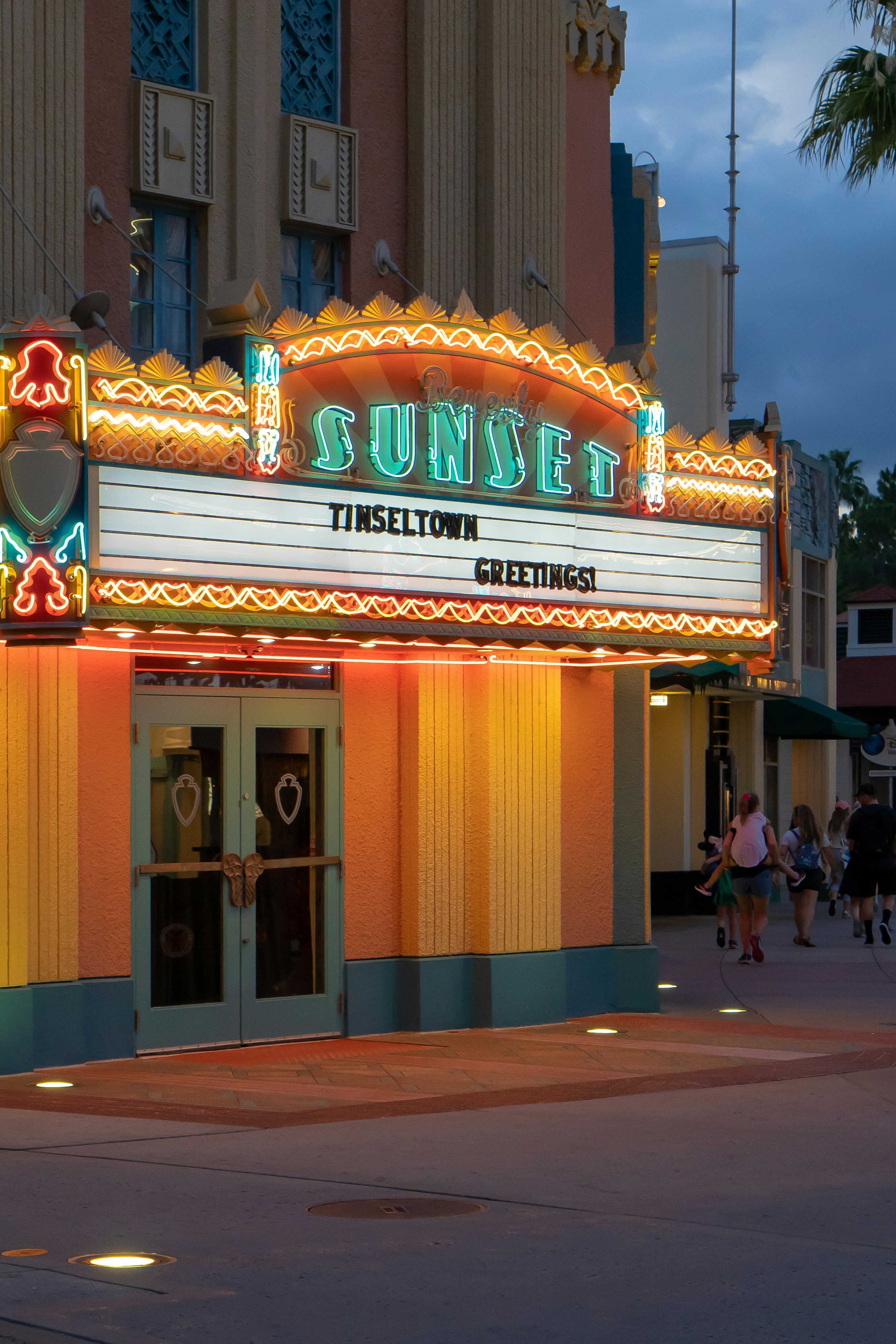 A building with a sign that says sunset theatre