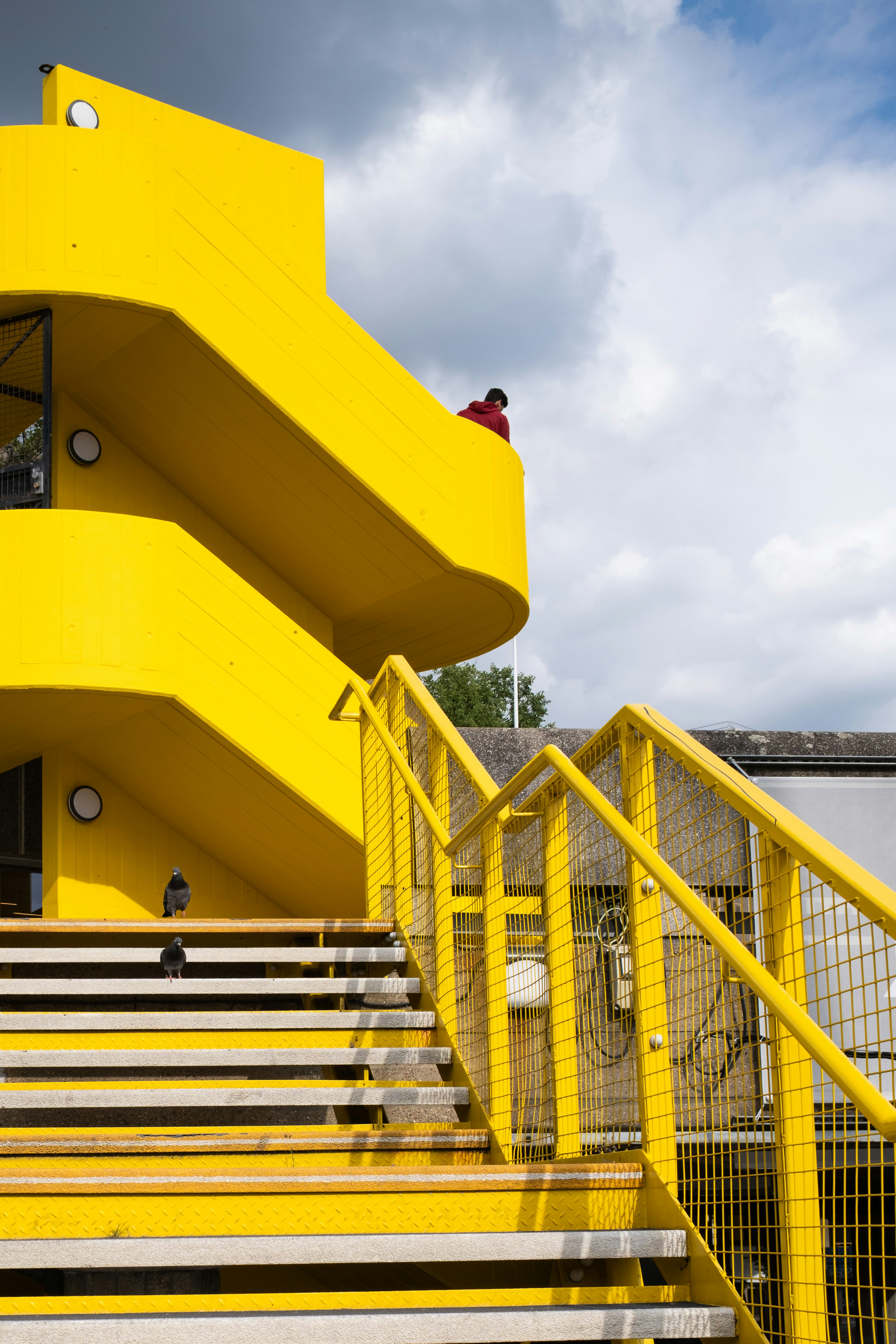 A yellow building with stairs leading up to it