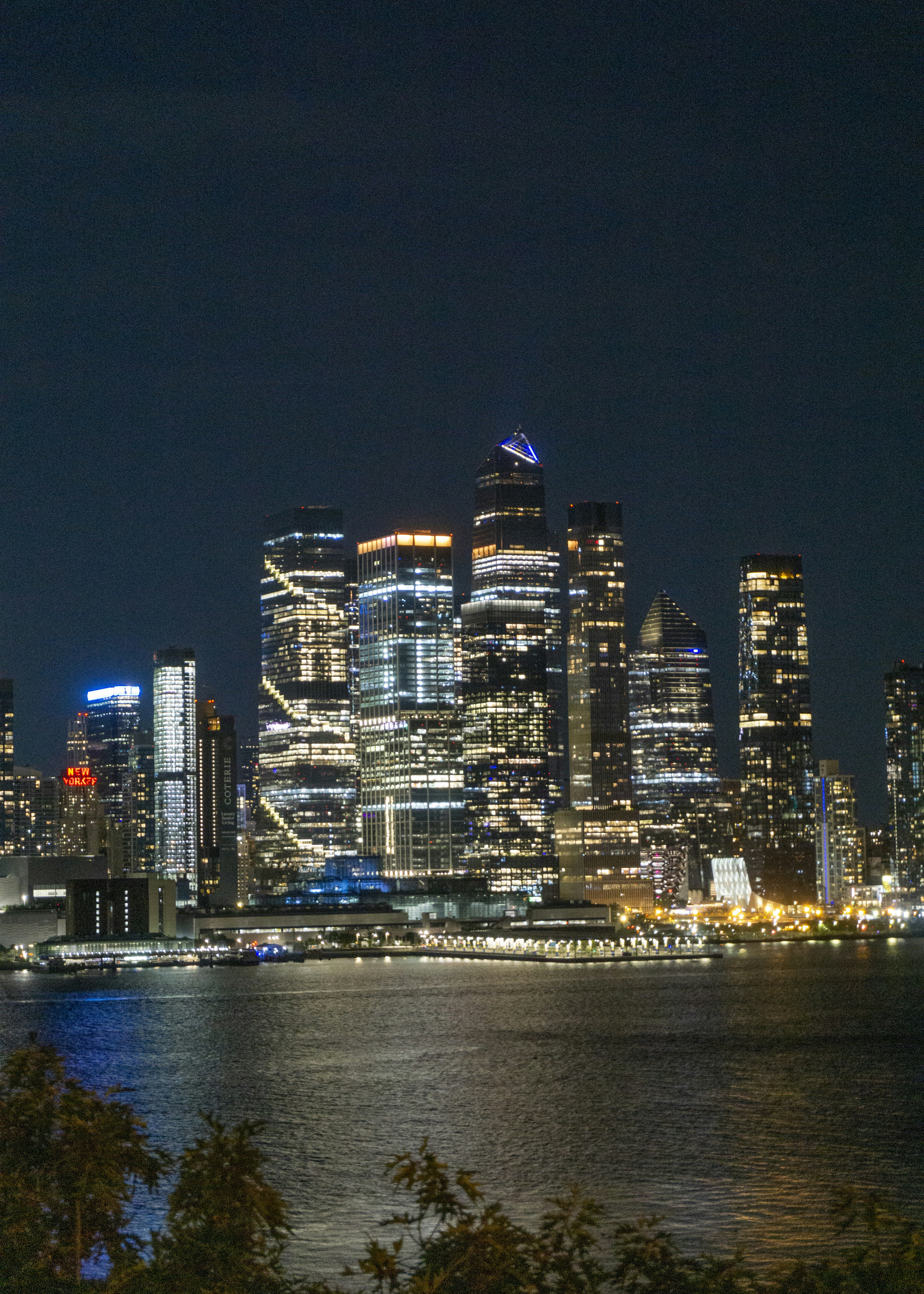 A view of a city at night from across the water