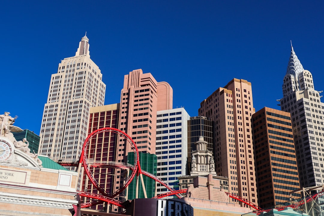 A large city with tall buildings and a roller coaster, New York New York hotel