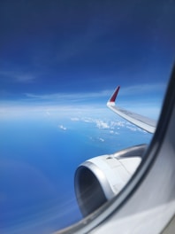 A view of the wing of an airplane in the sky