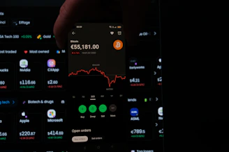 A person holding a cell phone in their hand