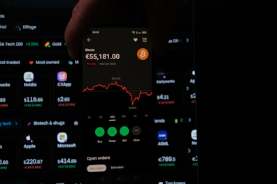 A person holding a cell phone in their hand