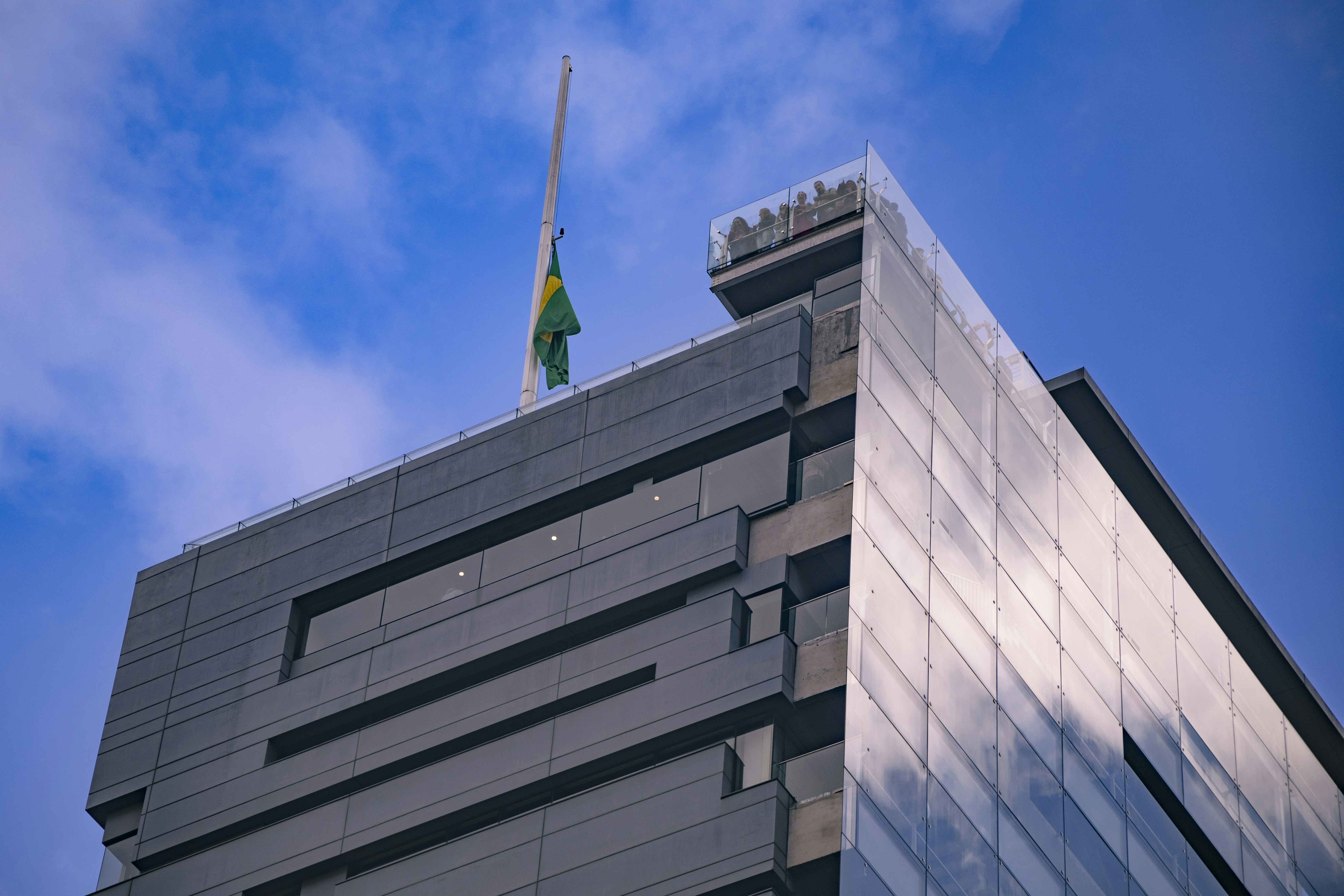 A tall building with a flag on top of it