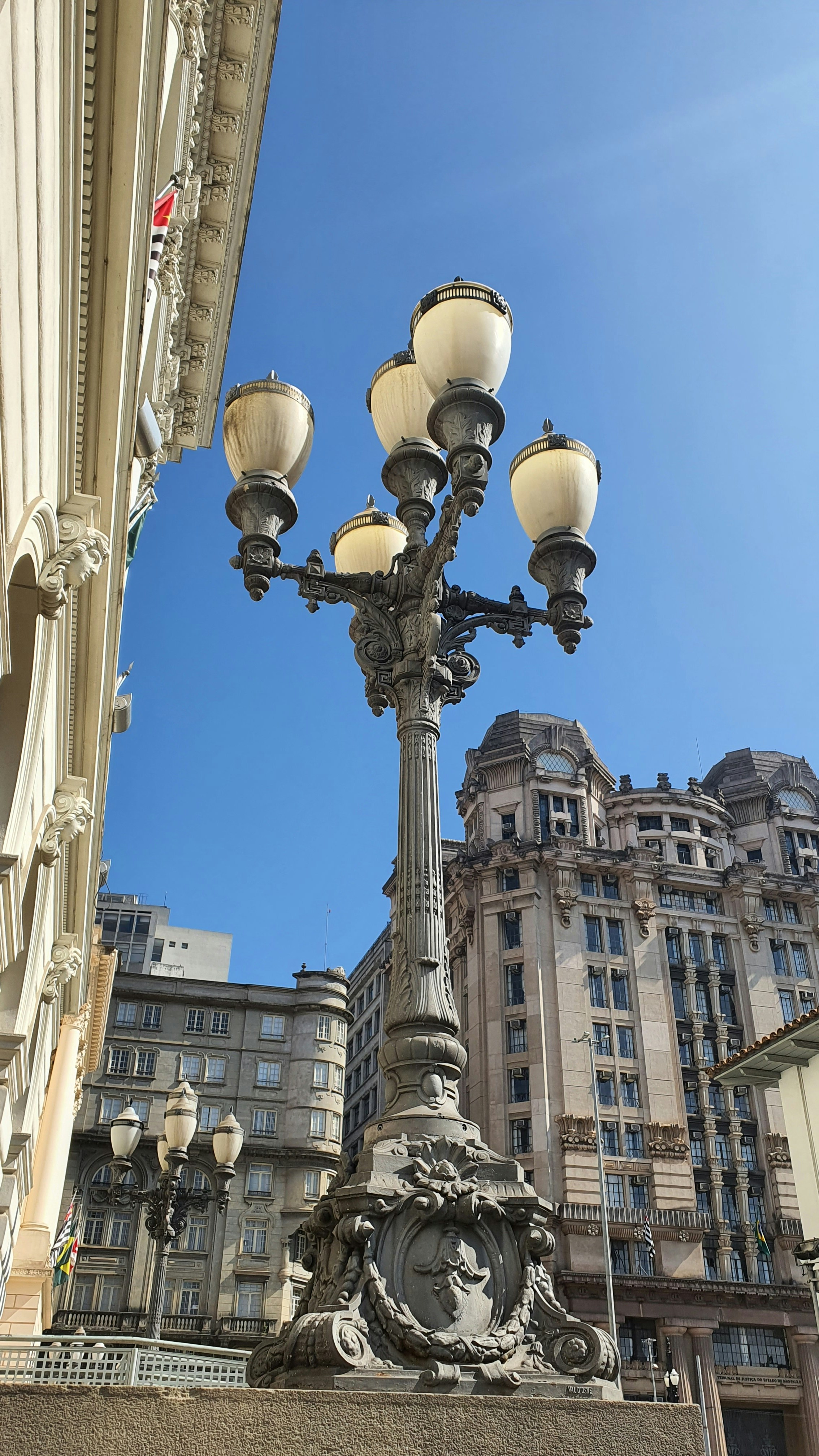 A lamp post in front of a large building