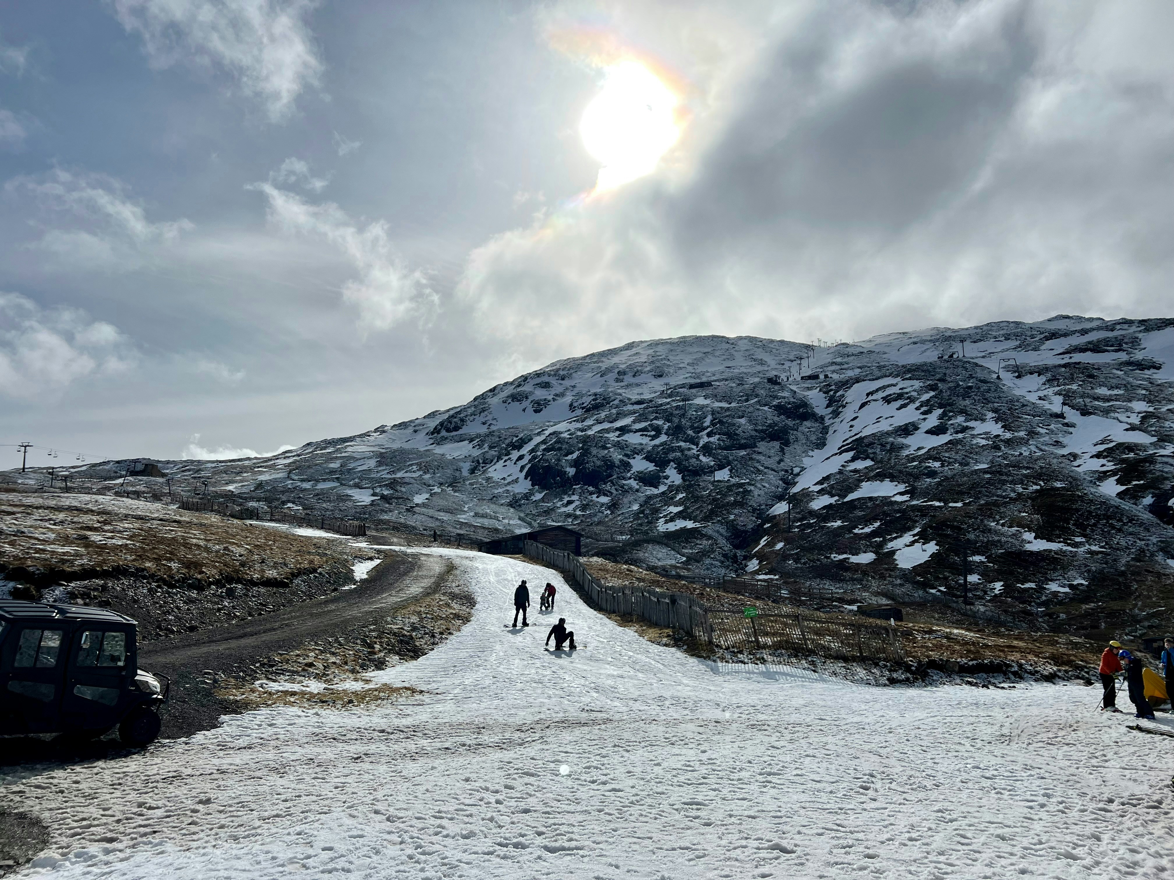 A group of people walking down a snow covered road