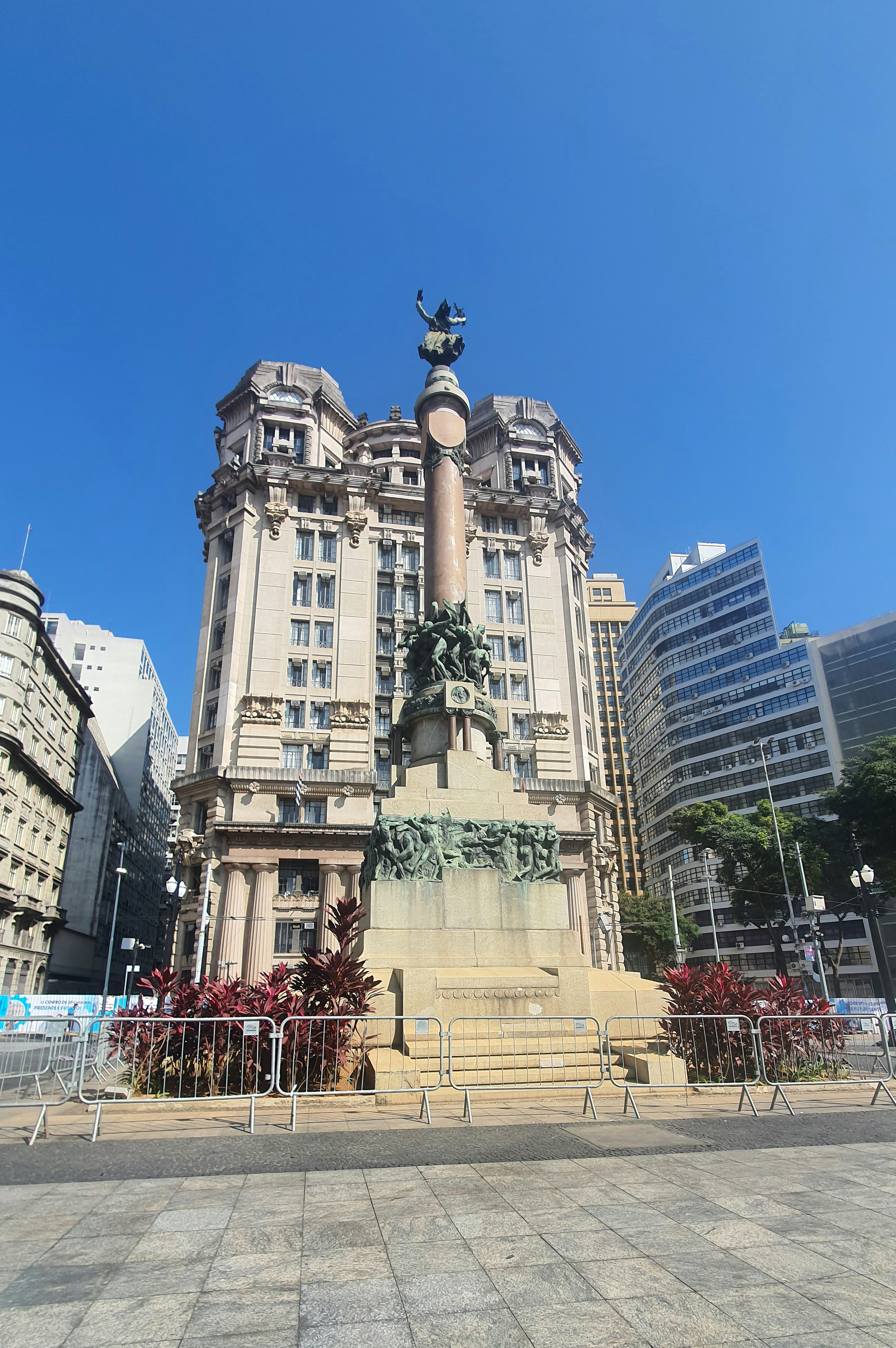 A large building with a statue in front of it