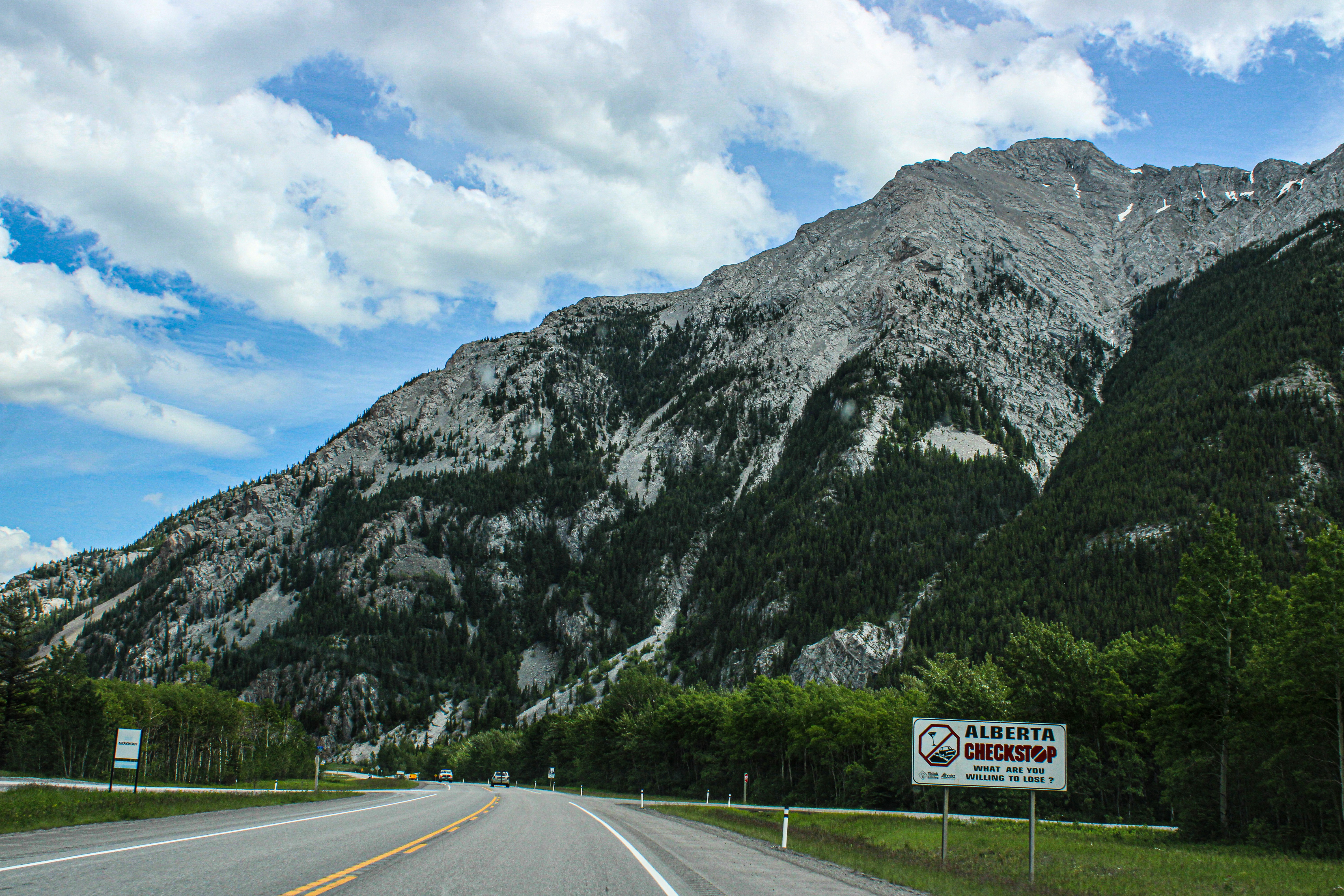 A road with a mountain in the background