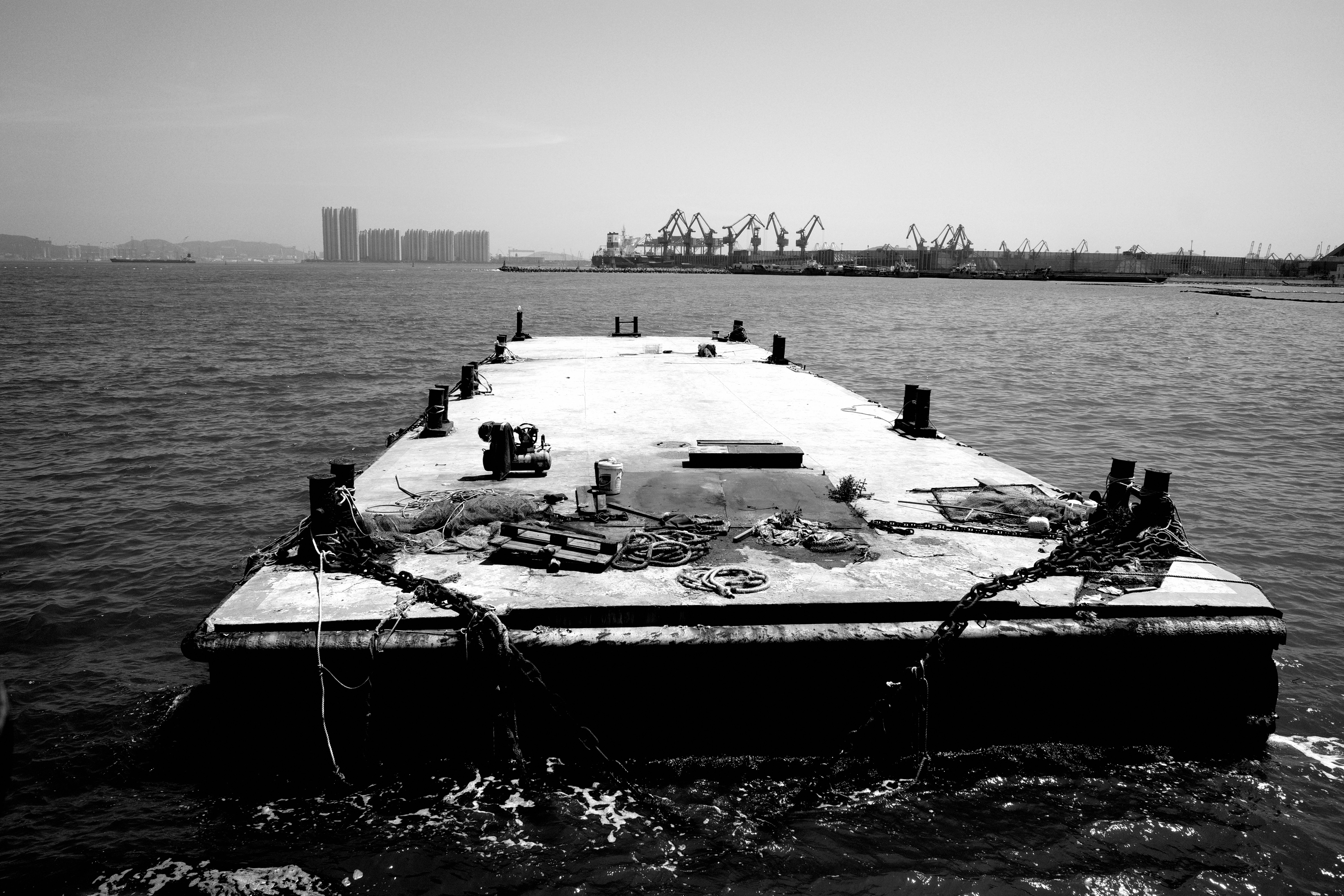 A black and white photo of a boat in the water