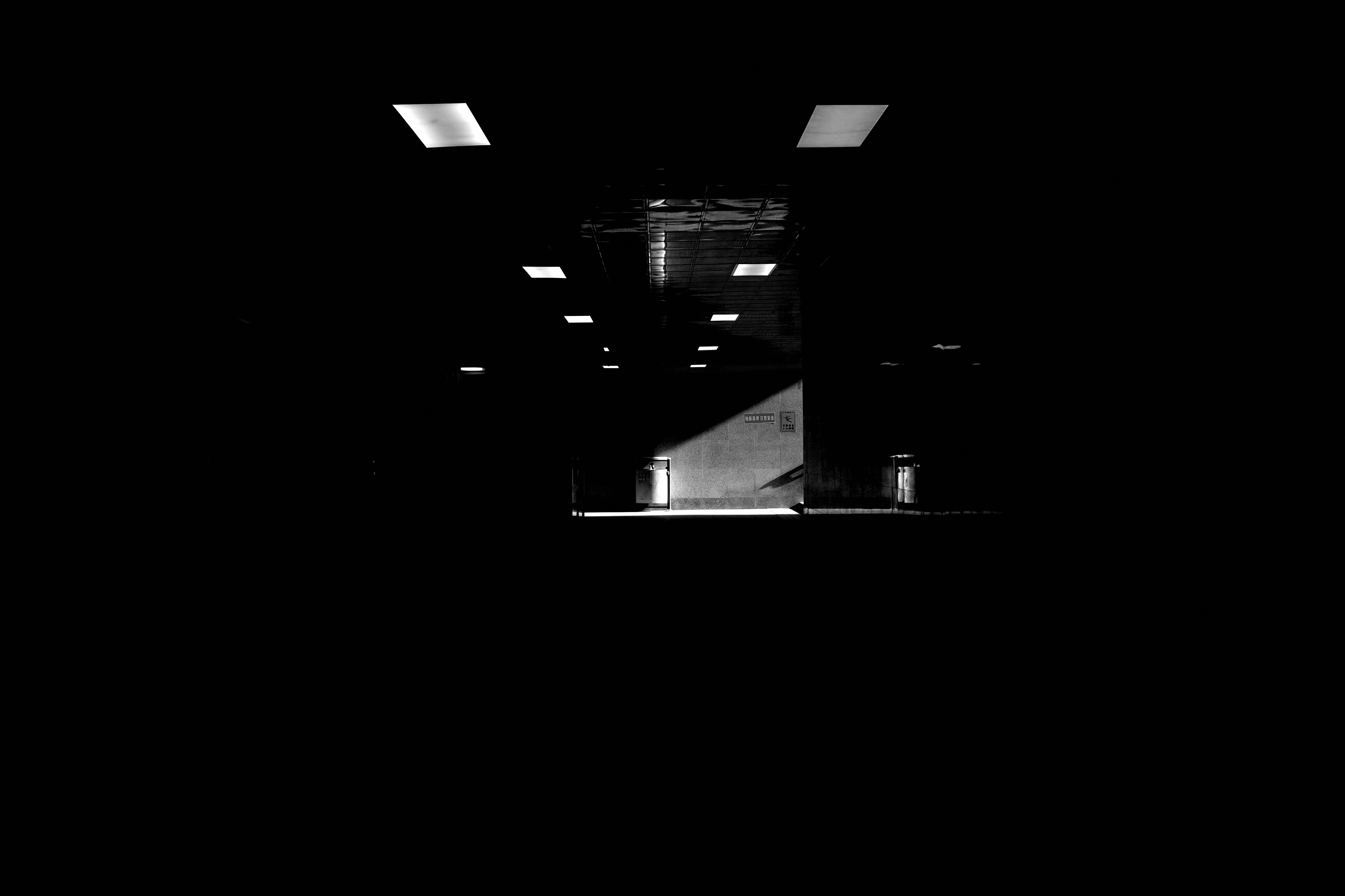 A black and white photo of a dark room