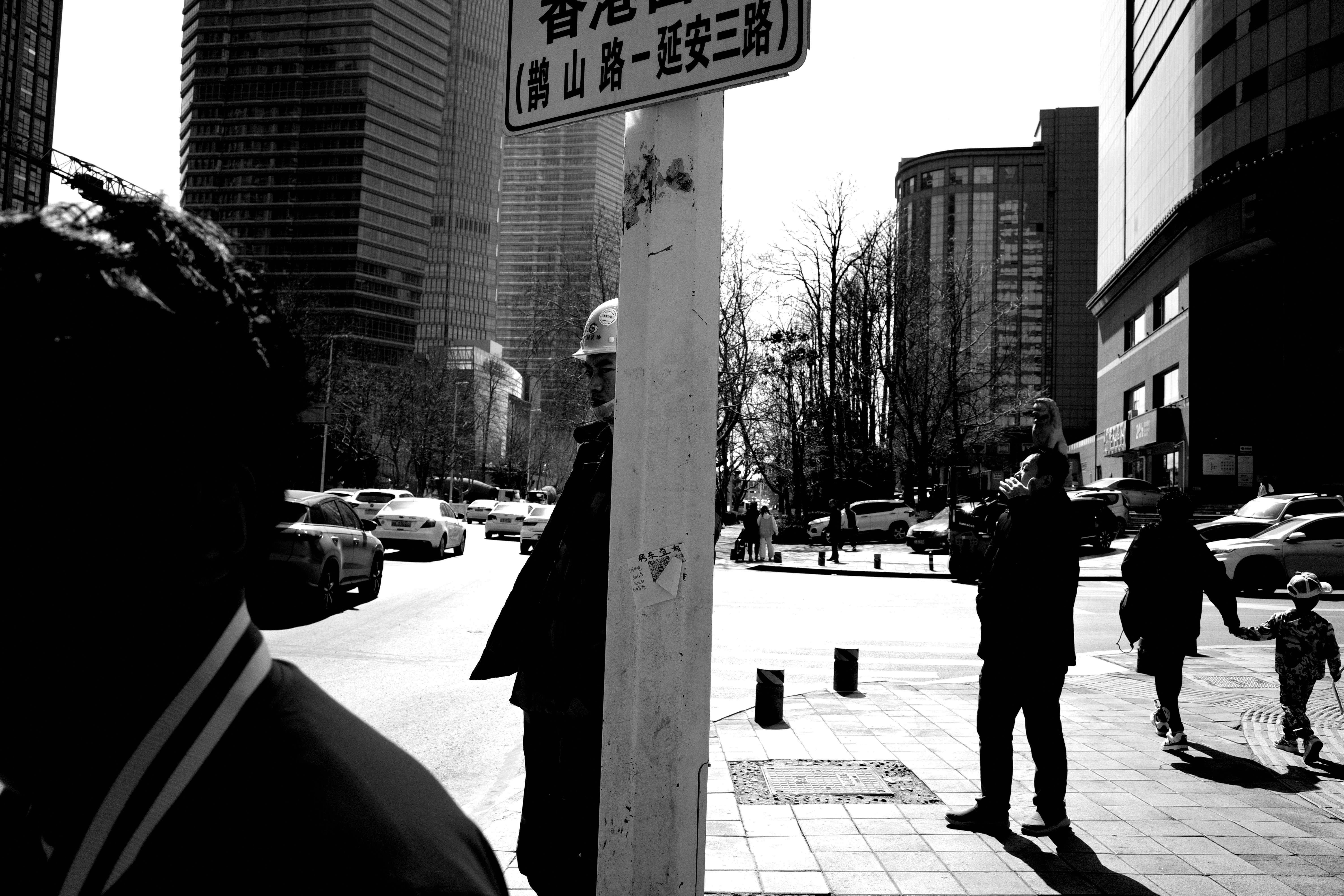 A black and white photo of a street sign