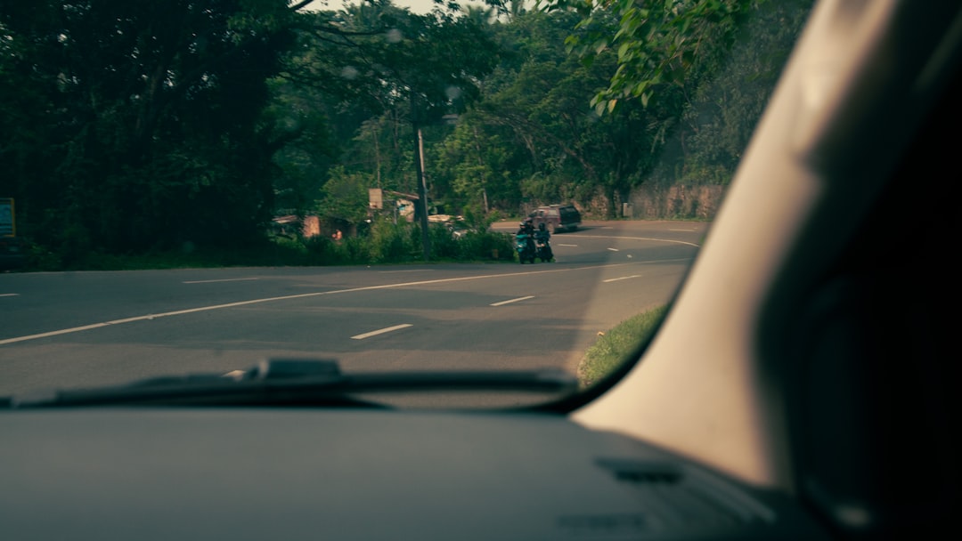 A view of a street from inside a car,