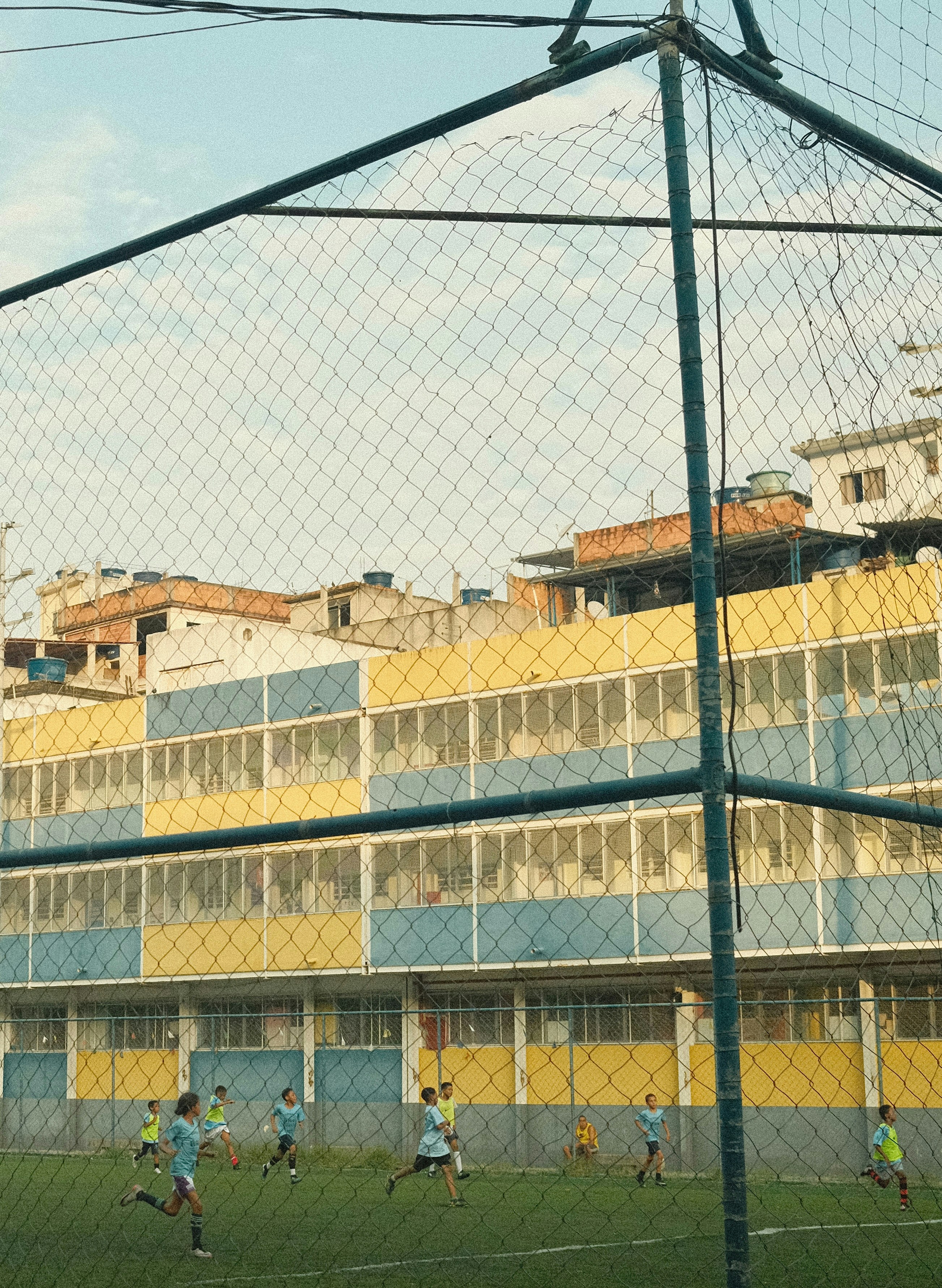 A group of people playing a game of soccer