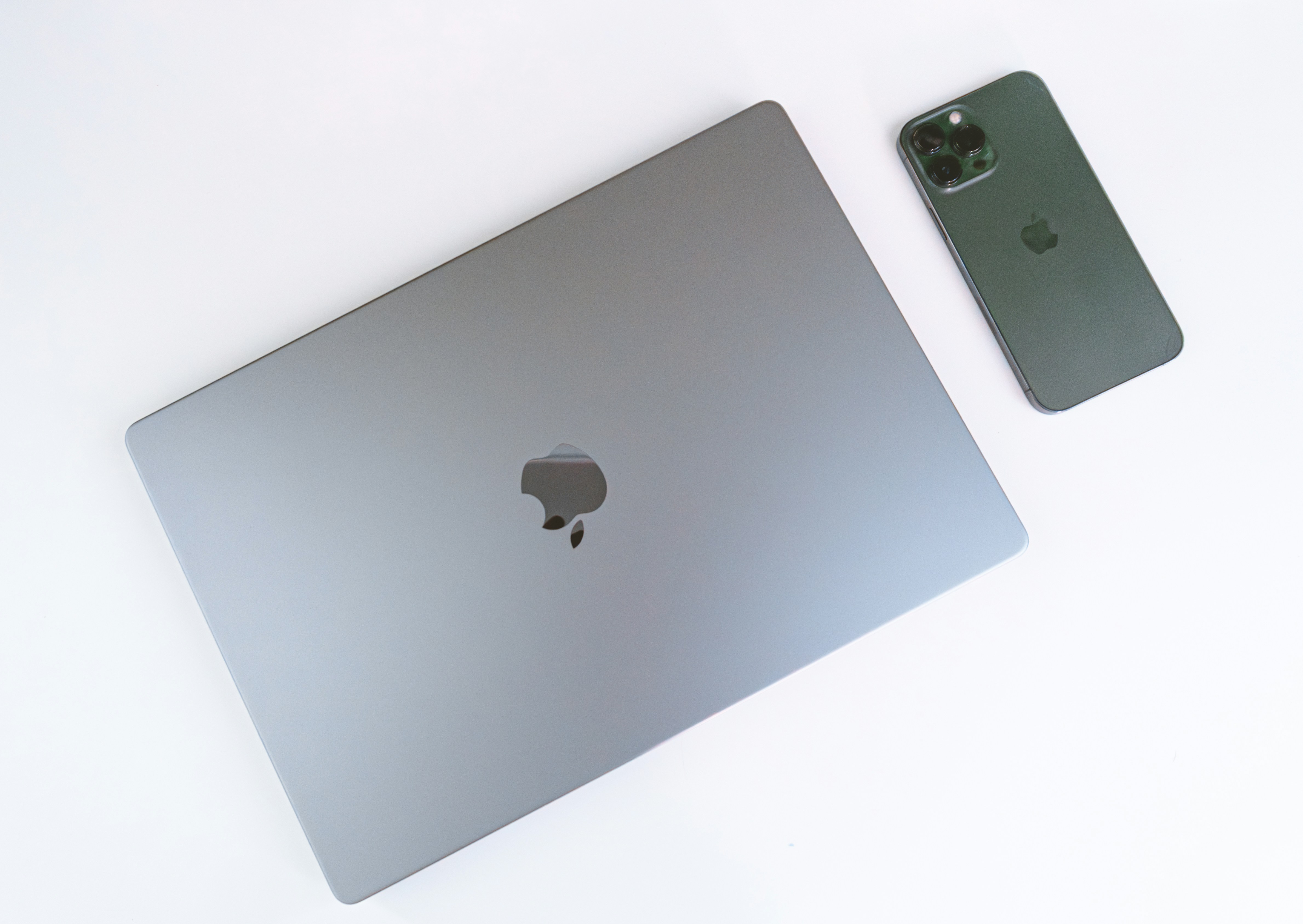 A laptop computer sitting on top of a white table