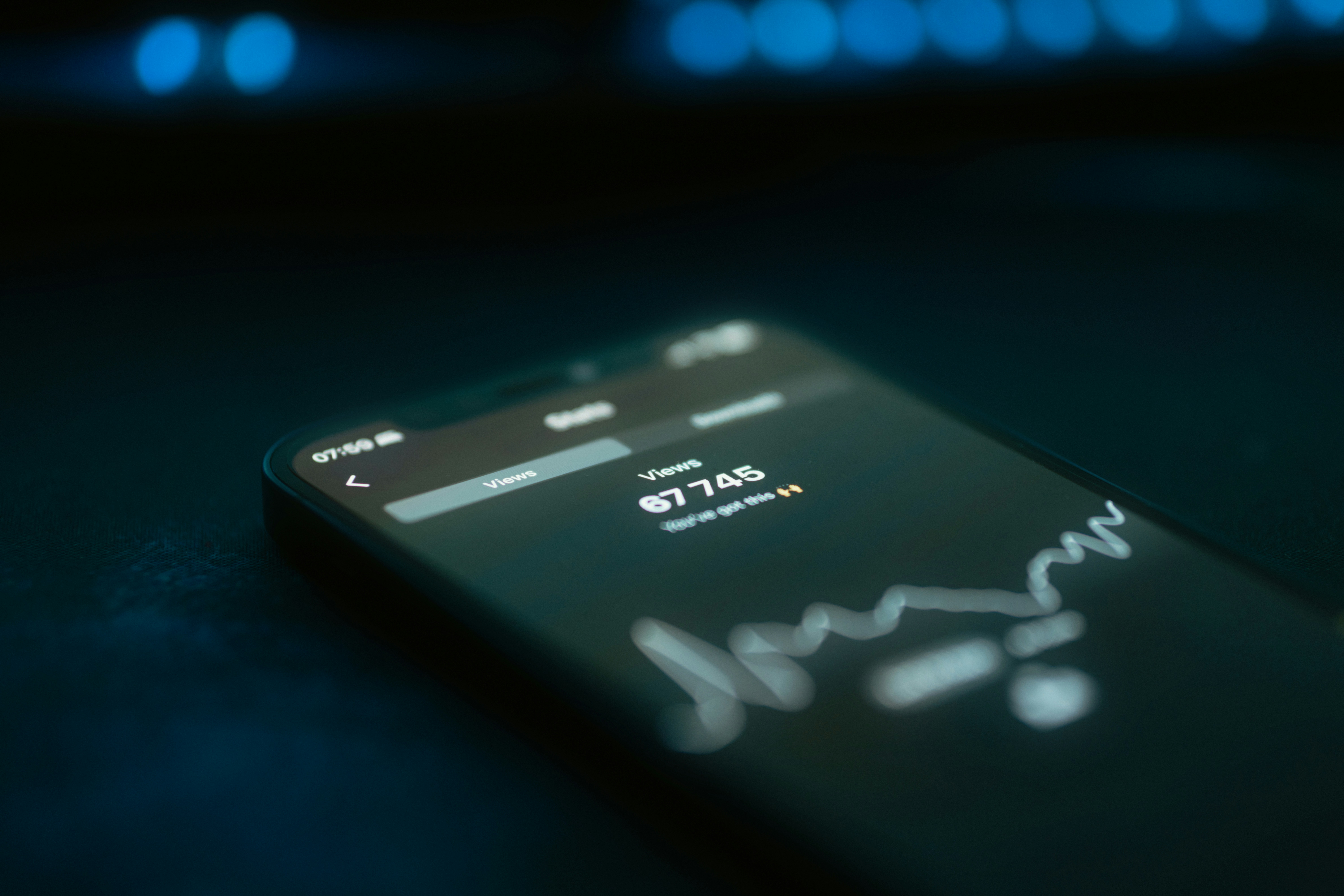 close up of smartphone screen displaying glowing voice assistant interface