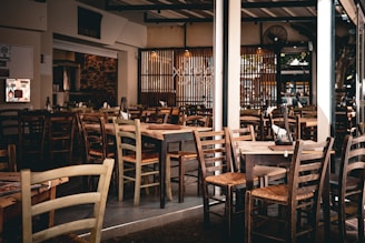 A restaurant filled with wooden tables and chairs