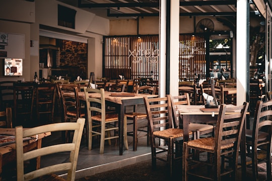 A restaurant filled with wooden tables and chairs