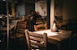 A person sitting at a table in a restaurant